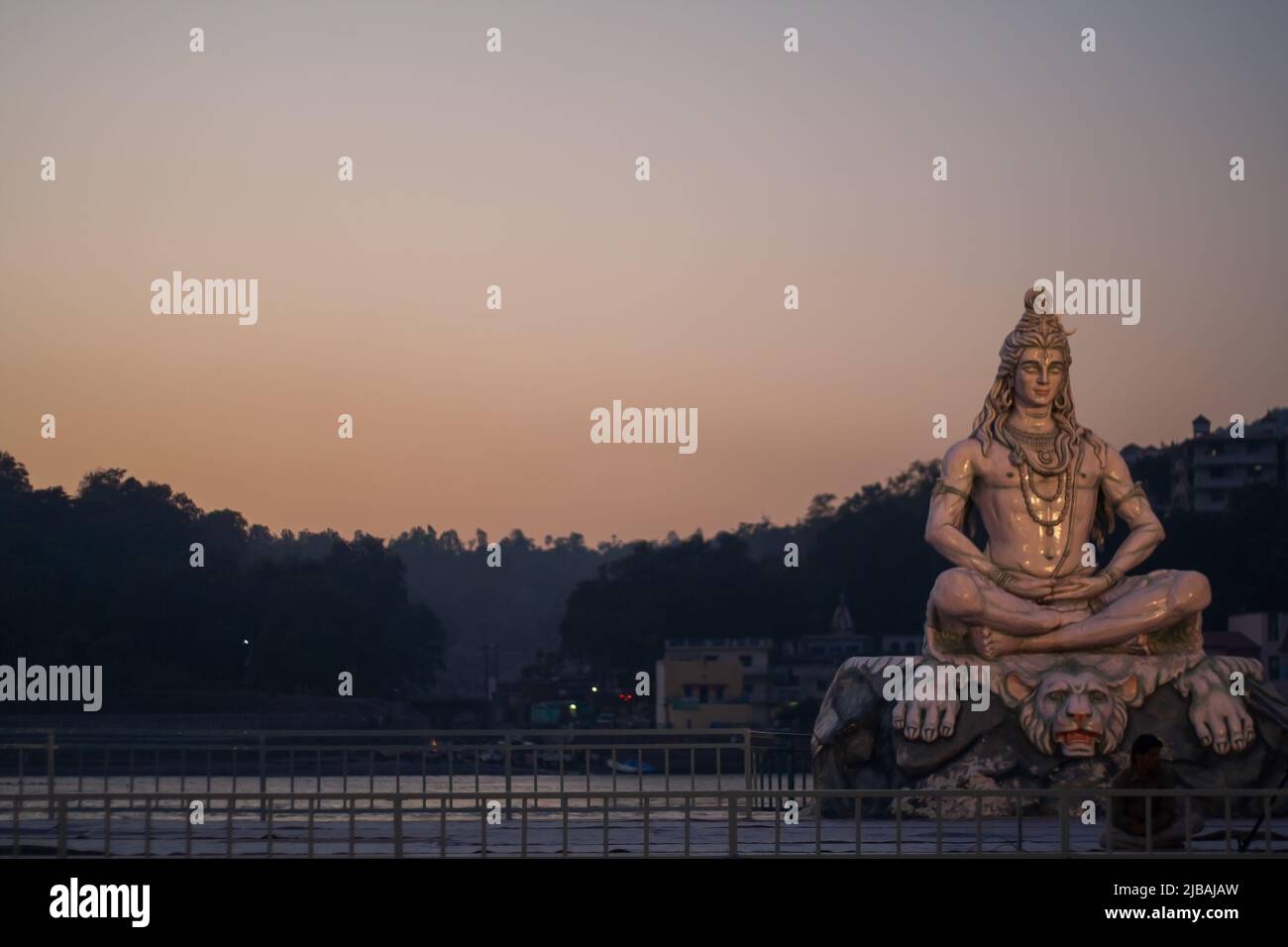 Rishikesh, India - 7 October 2012: Statue of Shiva sitting in meditation on the riverbank of Ganga in Rishikesh. Stock Photo