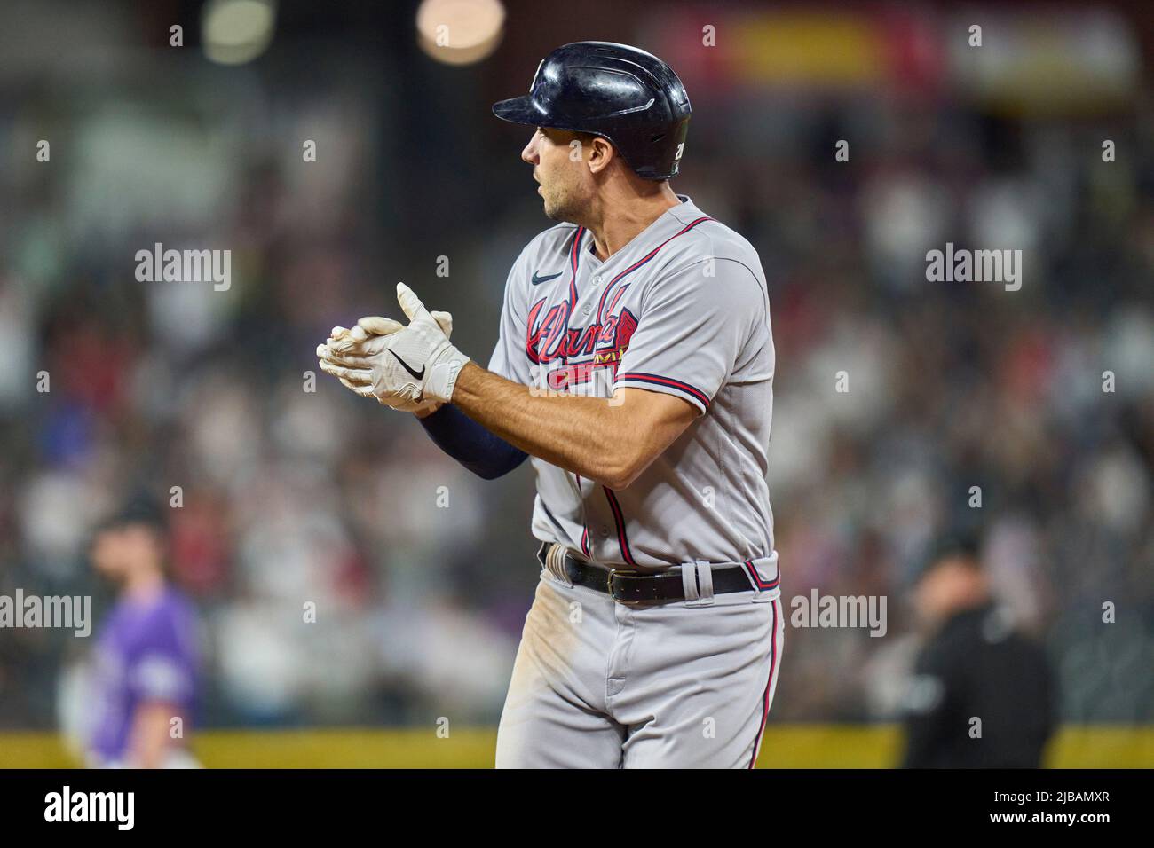 Denver CO, USA. 3rd June, 2022. Atlanta first baseman Matt Olsen (28)  drives in runs int he 10 th inning during the game with Atlanta Braves and  Colorado Rockies held at Coors