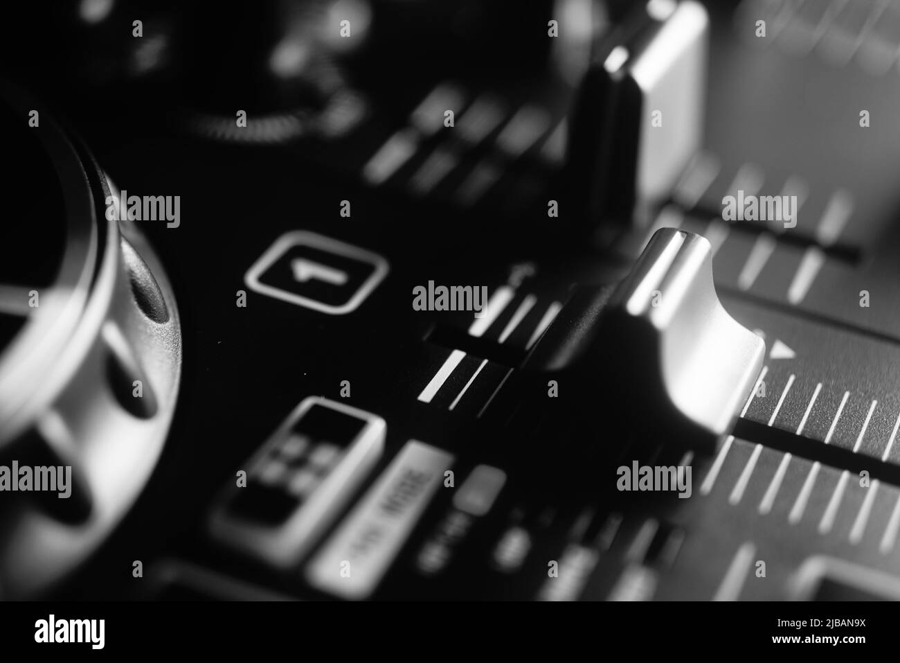 Deejay mixing desk black and white photo in Ibiza nightclub house music party. Stock Photo