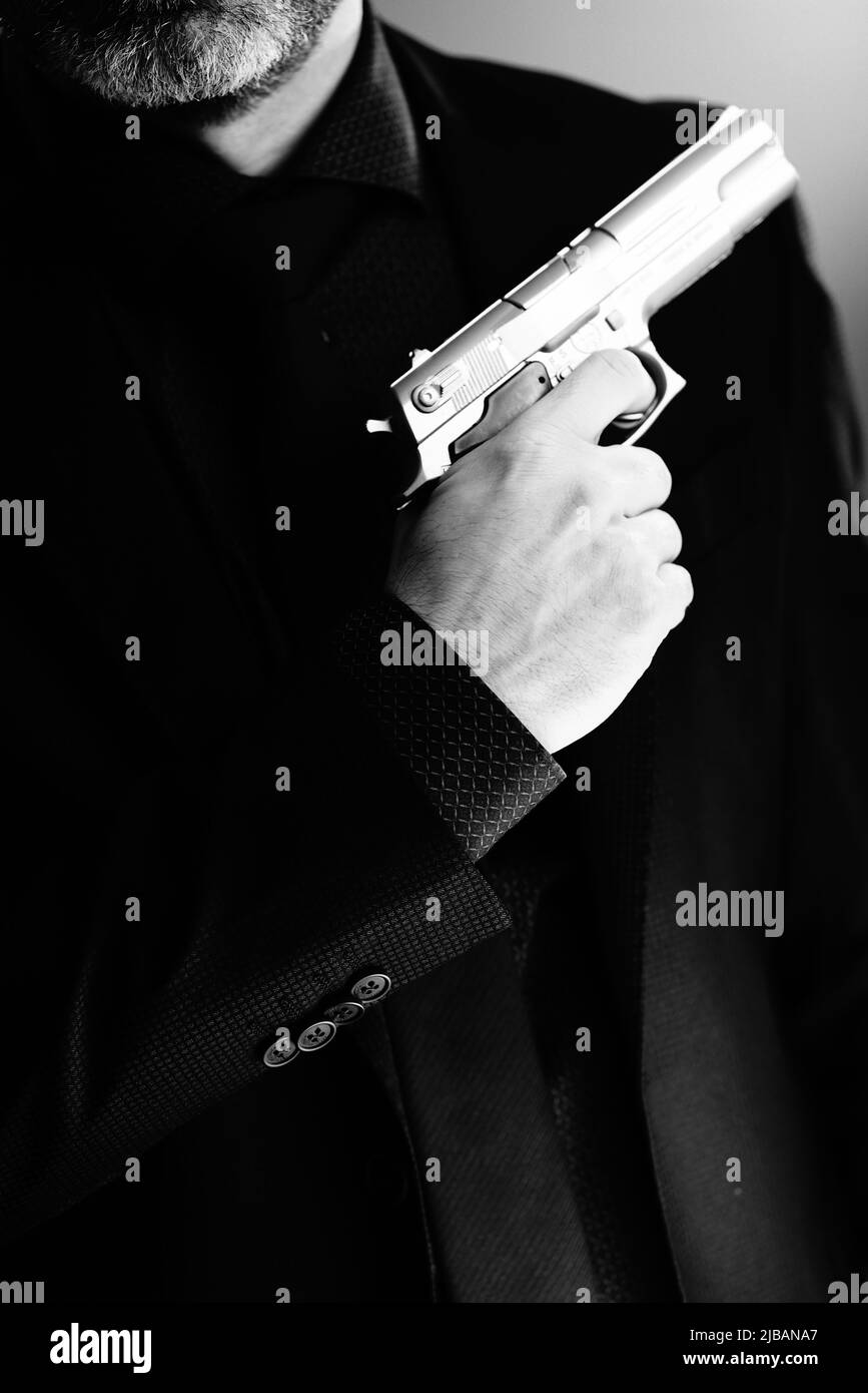 Well dressed male secret agent detective spy wearing suit and tie