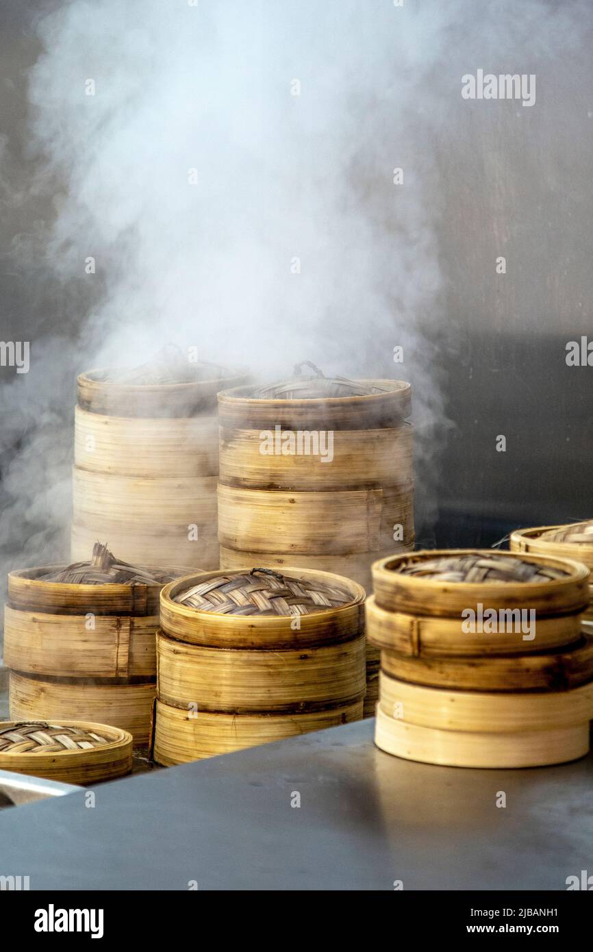 Steaming dumpling baskets at Baoziin, Cargo Markethall in Canary Wharf, London, UK Stock Photo