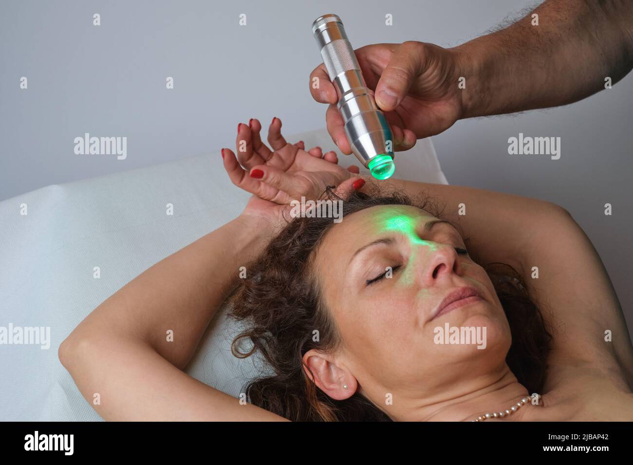 skin stimulation with electromagnetic frequencies Stock Photo