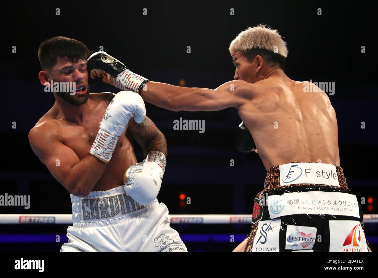 Joe Cordina (left) and Kenichi Ogawa in the International Boxing Federation World Super Feather Title at the Motorpoint Arena Cardiff. Picture date: Saturday June 4, 2022. Stock Photo