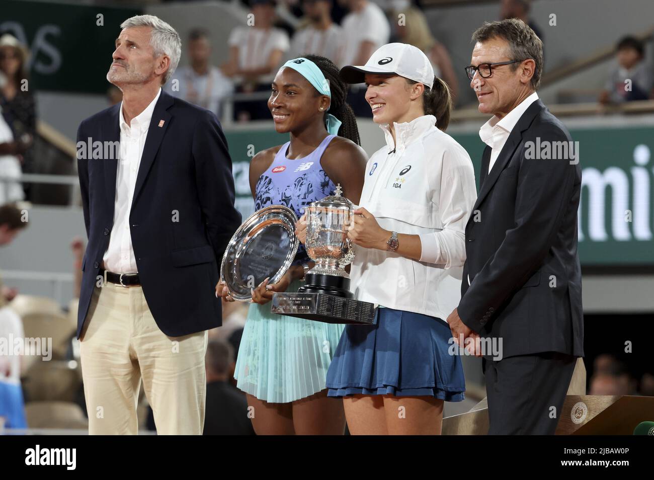 Gilles Moretton, President of the French Tennis Federation FFT, finalist  Coco Gauff of USA, winner Iga Swiatek of Poland, trophy presenter Mats  Wilander during the women's final trophy ceremony on day 14