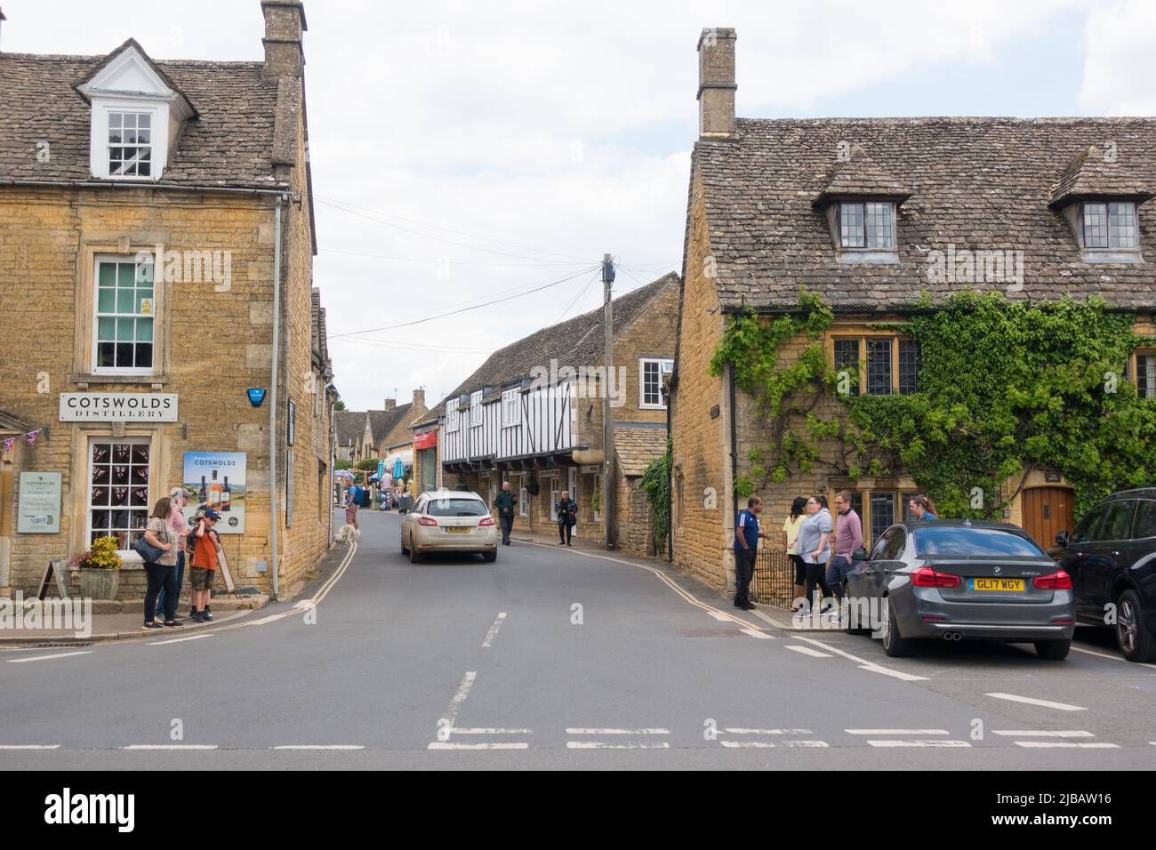 Bourton on the water high street with Cotswold distillery Stock Photo