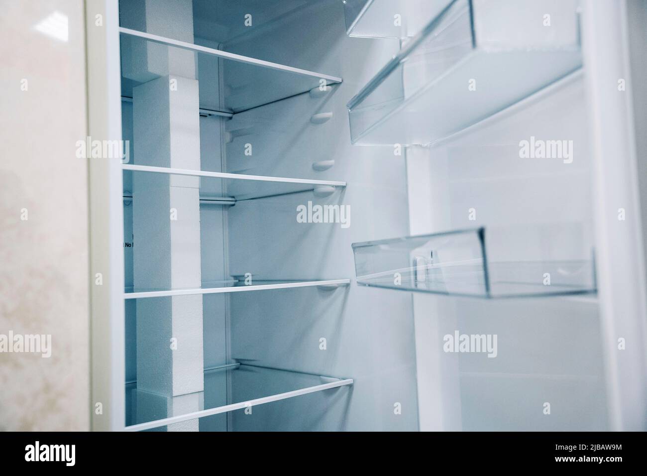 empty shelves of an open refrigerator. a new refrigerator Stock Photo