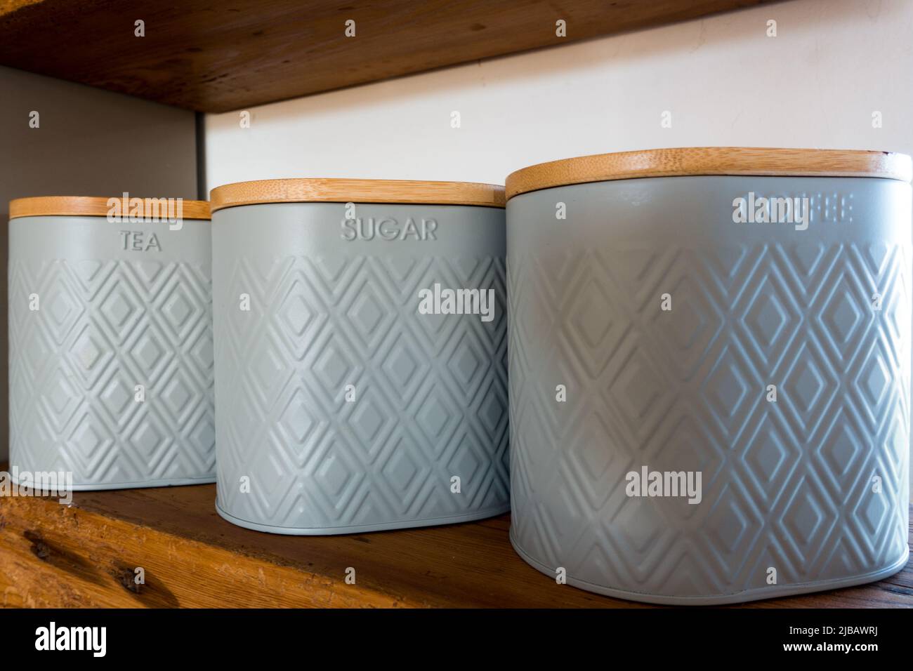 Tea Coffee Sugar canister in coordinated set in Kitchen shelf Stock