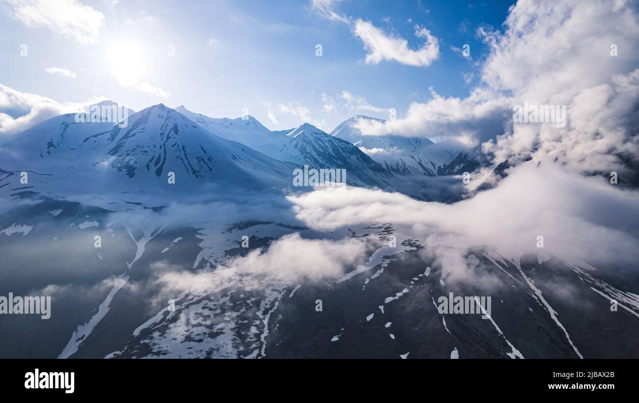 birds-eye view of glorious snowy Caucasus mountains, Stepantsminda, Georgia. High quality photo Stock Photo