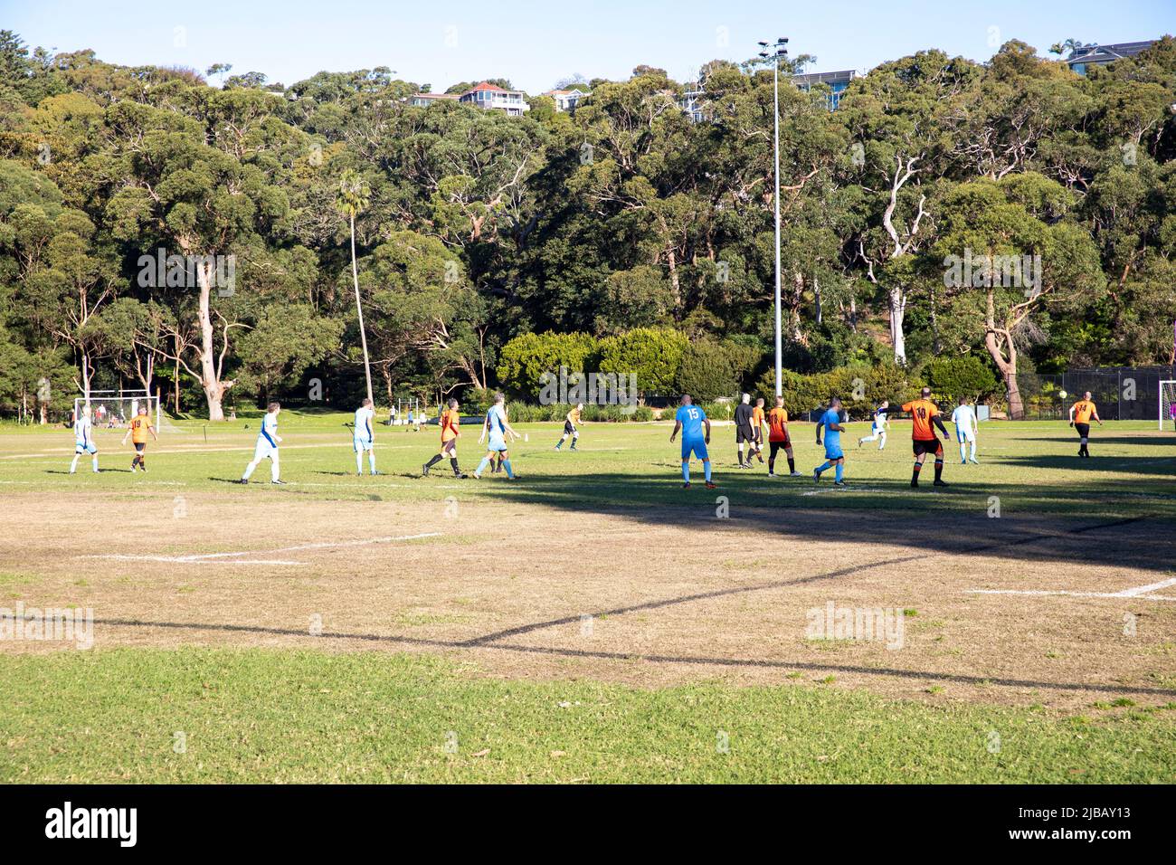 Amateur football soccer match in Sydney played at Balmoral beach oval, over 45's mens match in the Manly Warringah football league,Australia Stock Photo