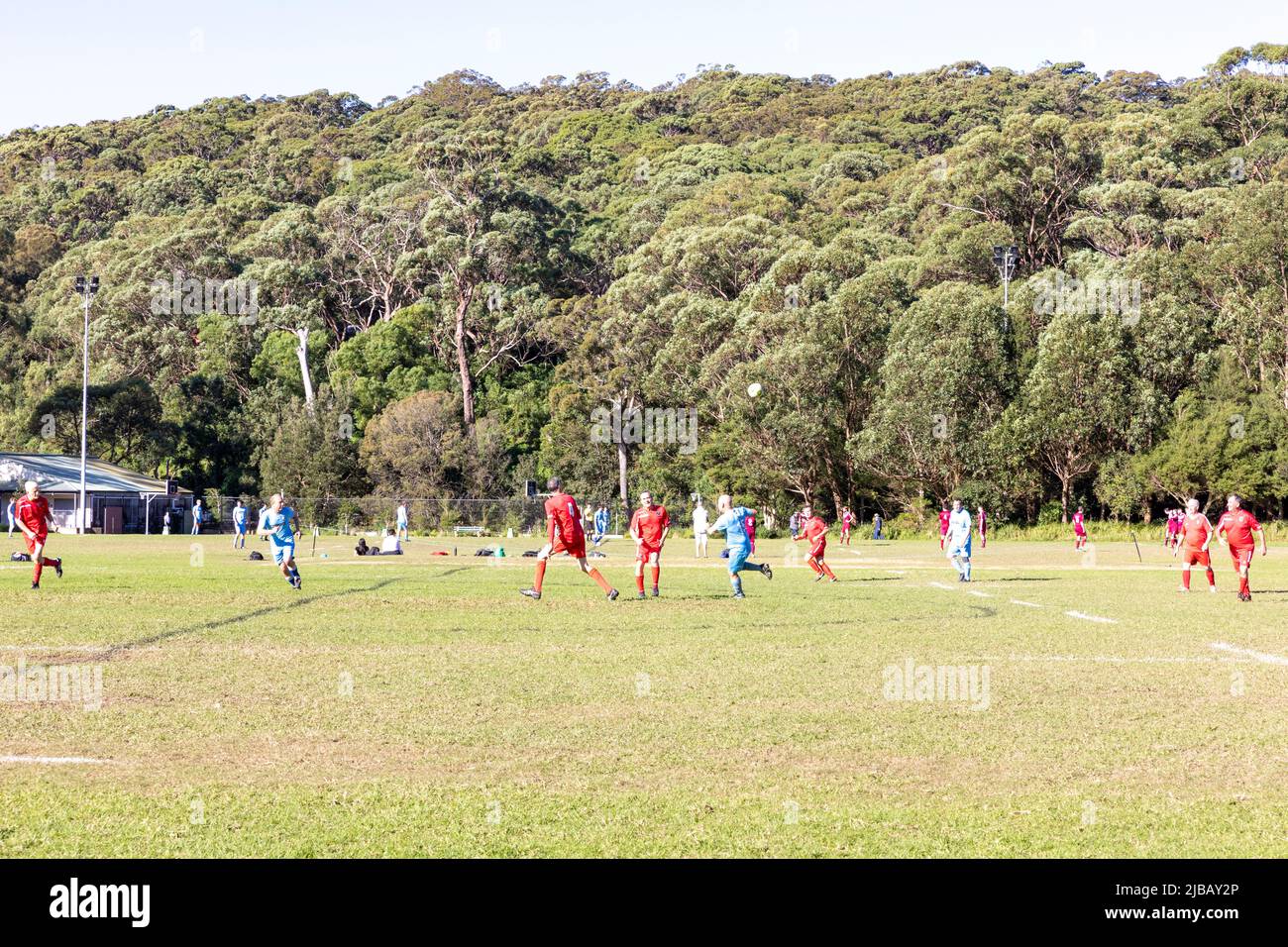 Amateur football soccer match in Sydney played at Balmoral beach oval, over 45's mens match in the Manly Warringah football league,Mosman, Australia Stock Photo