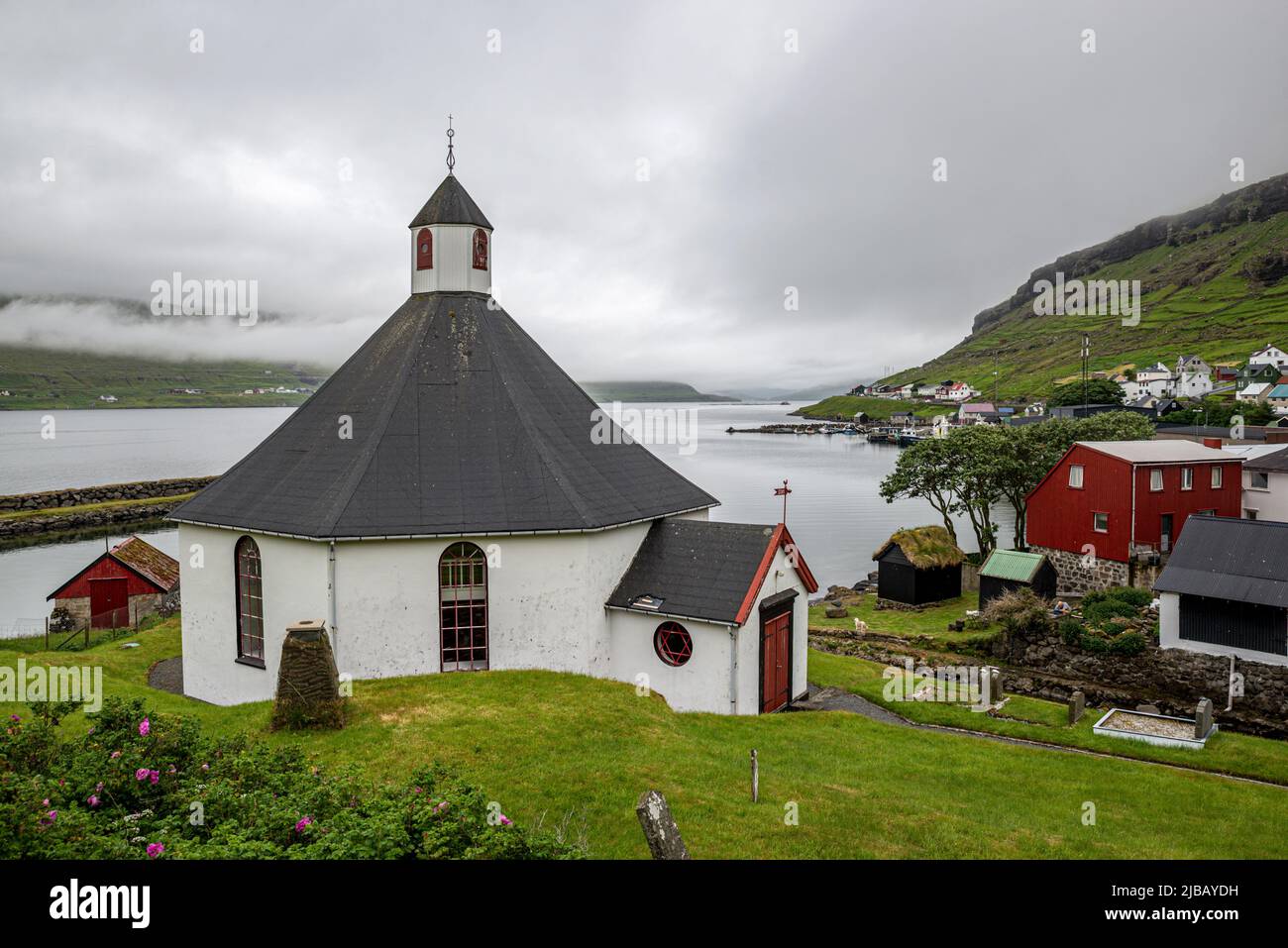 Octagonal church in Haldorsvik village, Eysturoy Island, Faroe Archipelago Stock Photo