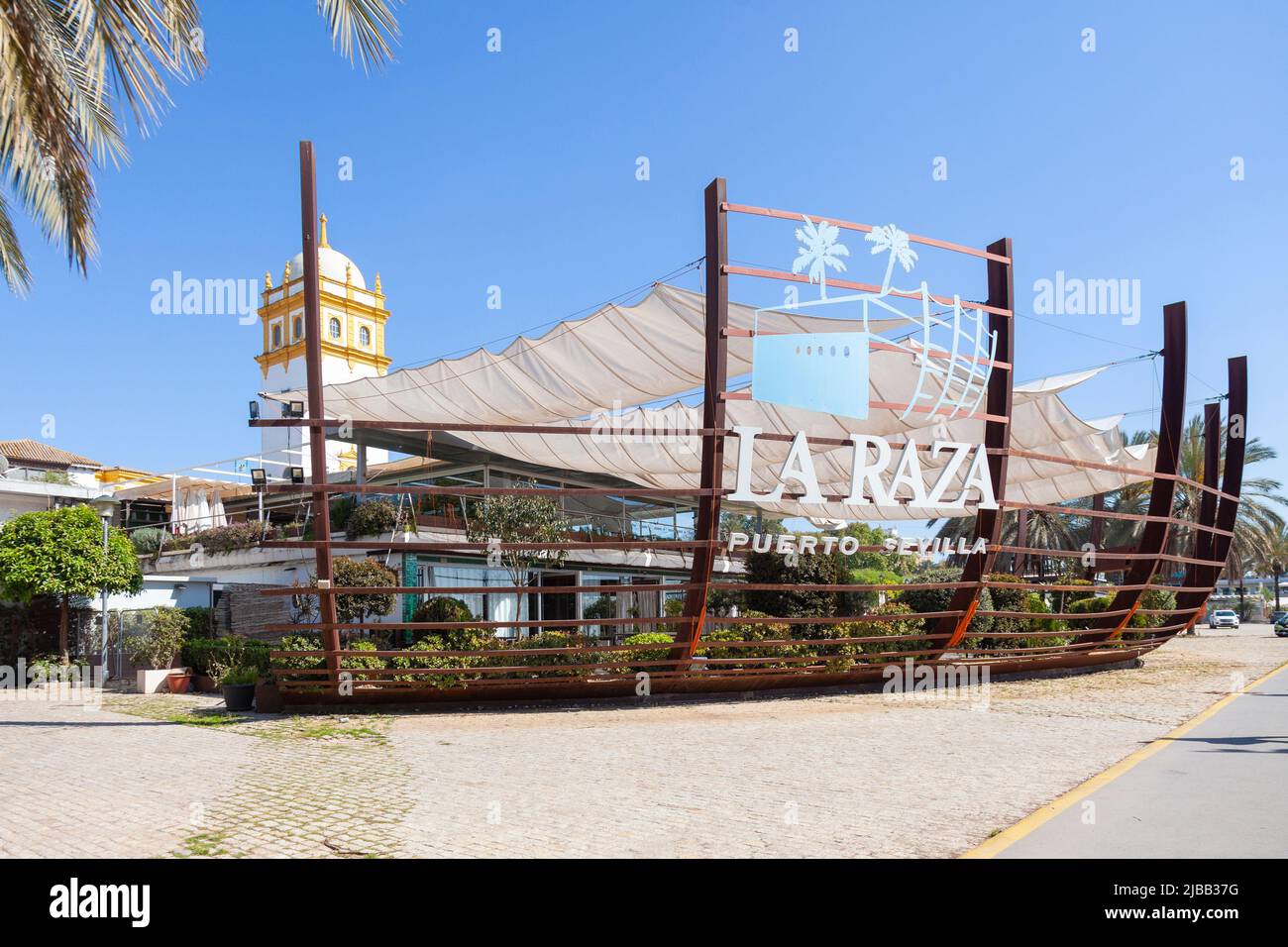 La Raza, a restaurant with architecture inspired by a boat's hull, on the promenade of the Guadalquivir River, Muelle de las Delicias, Port of Seville Stock Photo