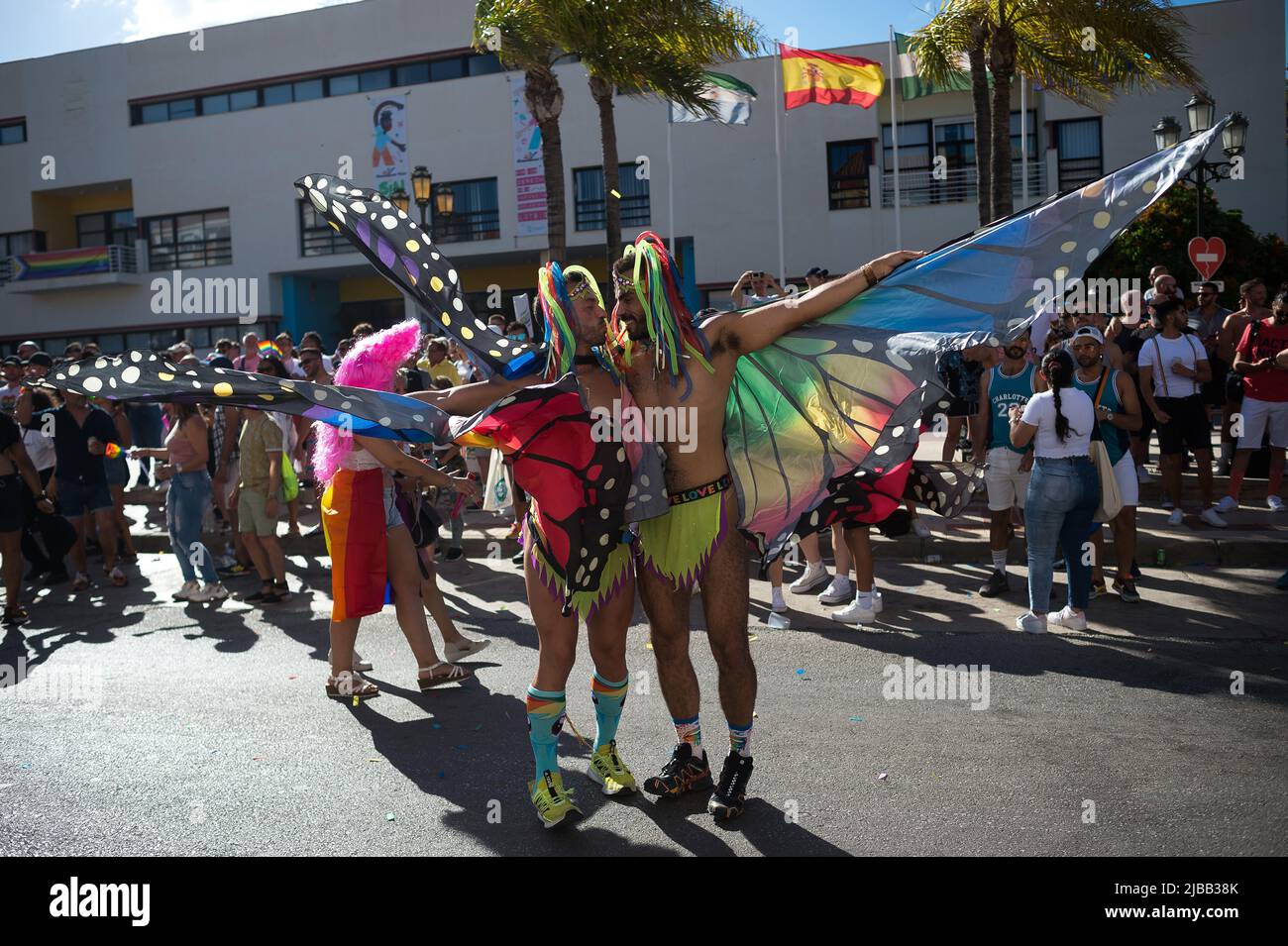 Malaga, Spain. 04th June, 2022. Two men dressed as butterflies are seen kissing as they take part in a demonstration in favor of LGTBI  people's rights, as part of the LGTBI  Pride celebrations. Thousands of people return in downtown Torremolinos to participate in the LGTBI  Pride parade after it was suspended for two years due to coronavirus pandemic. The parade is internationally renowned as a meeting point between LGTBI  people under a colourful and festive atmosphere. Credit: SOPA Images Limited/Alamy Live News Stock Photo