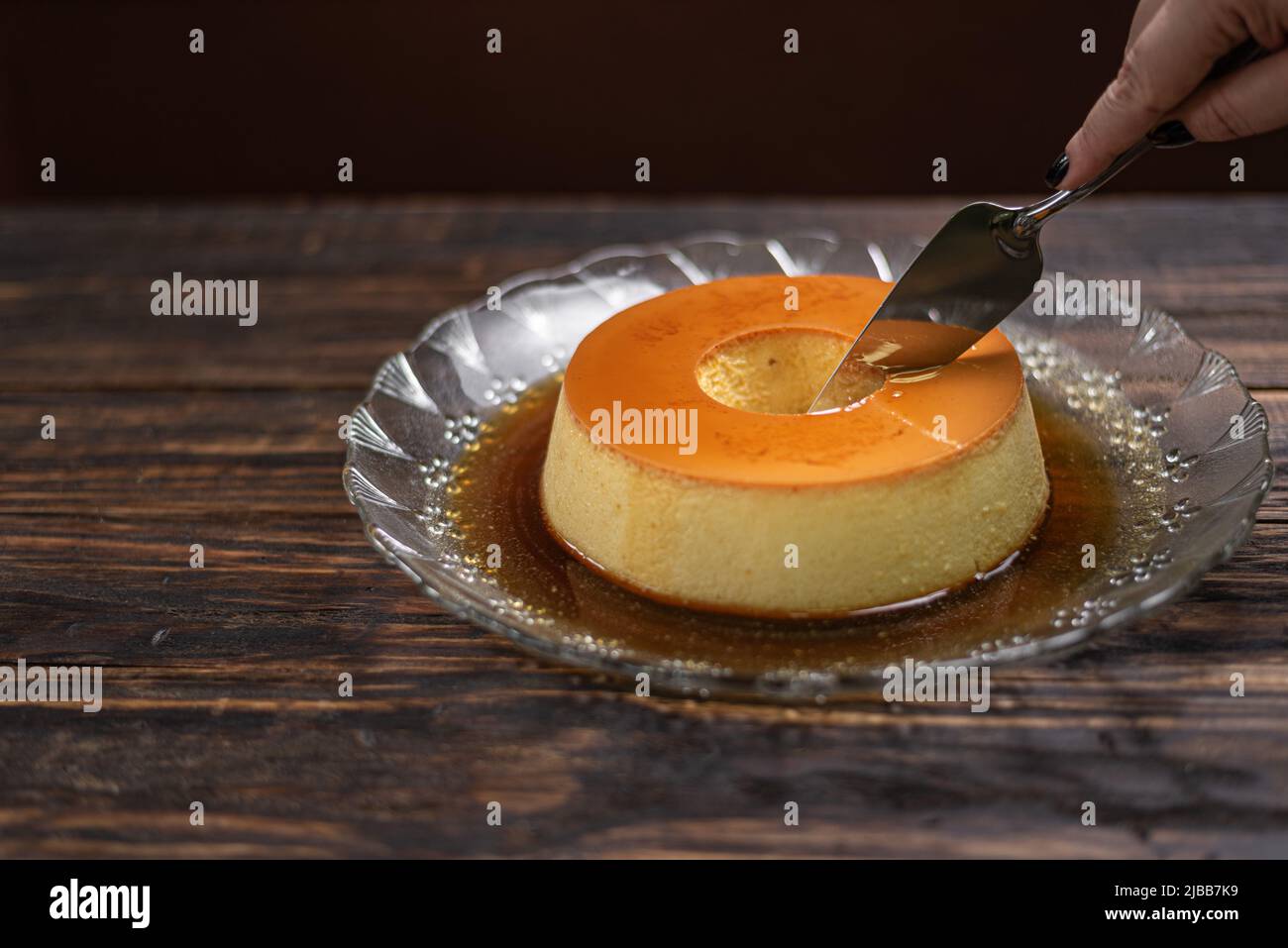 https://c8.alamy.com/comp/2JBB7K9/milk-pudding-or-pudim-de-leite-brazilian-dessert-homemade-caramel-custard-pudding-traditional-brazilian-flan-on-wooden-background-2JBB7K9.jpg