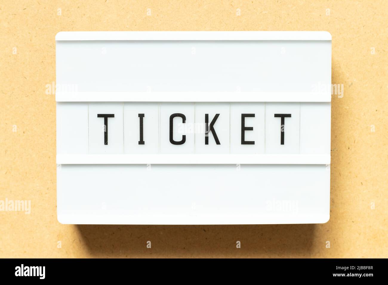 Lightbox with word ticket on wood background Stock Photo