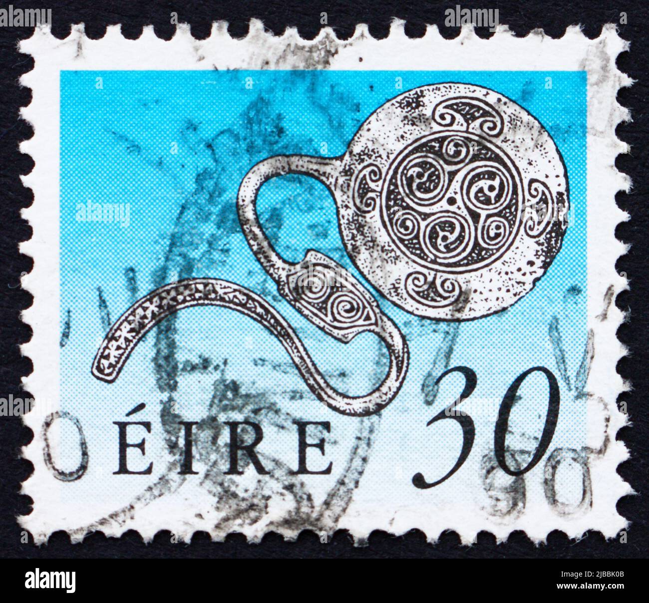 IRELAND - CIRCA 1990: a stamp printed in the Ireland shows Enamel Latchet Brooch, Art Treasure of Ireland, circa 1990 Stock Photo