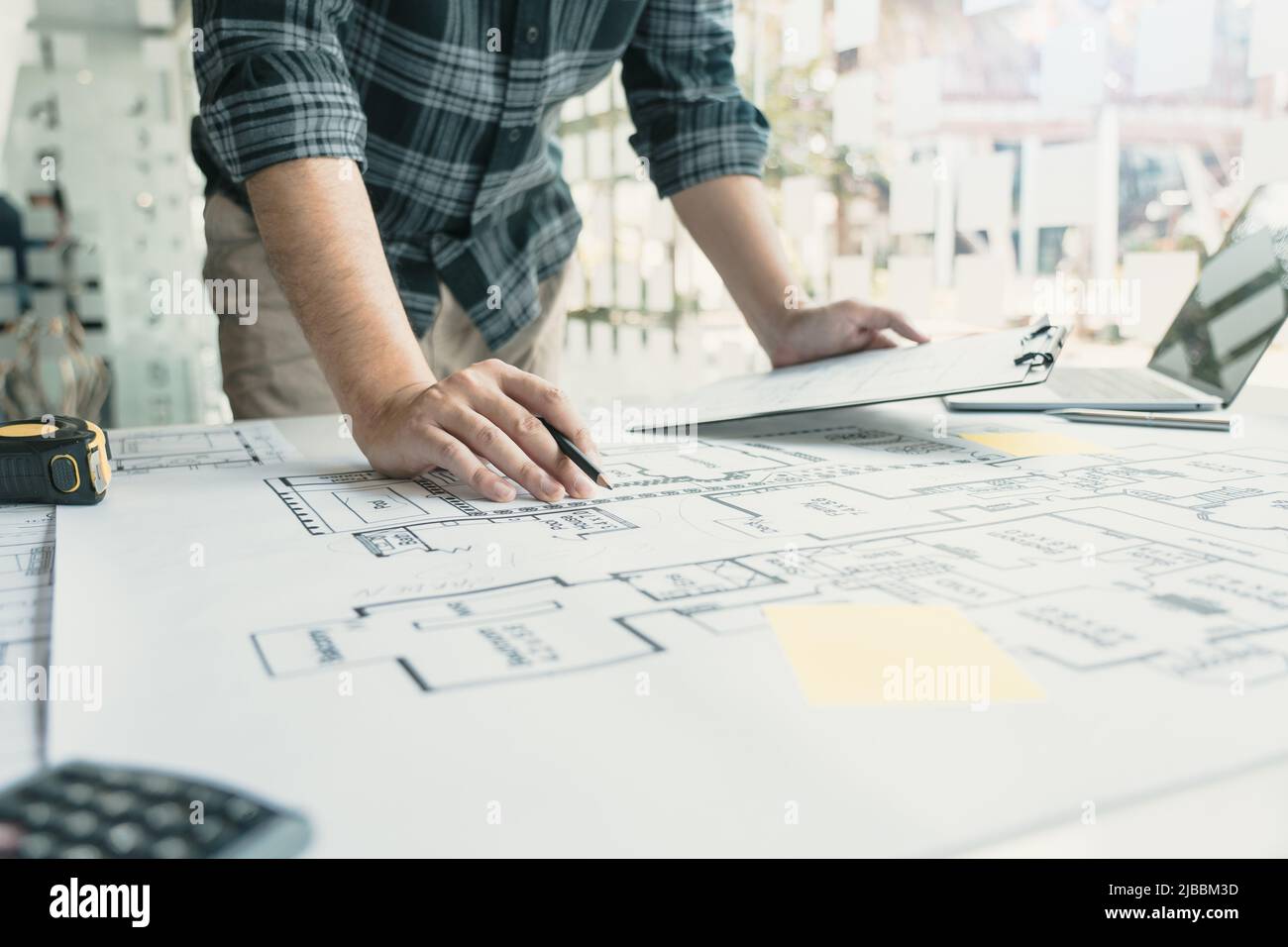 Business people reviewing blueprints desk hi-res stock photography and ...