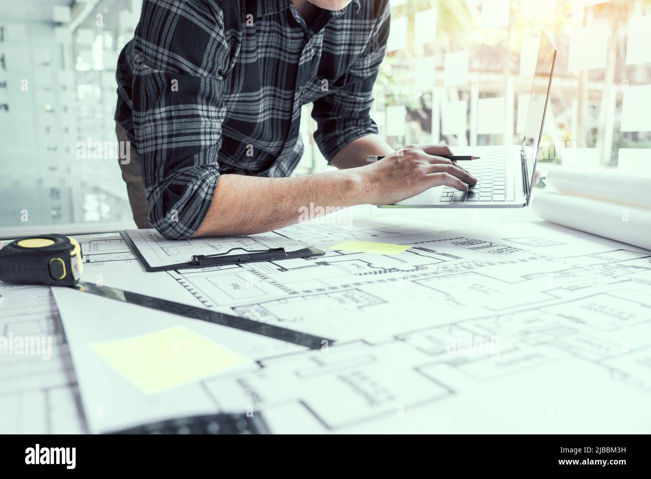 Architect working new project and using laptop with in office. Stock Photo