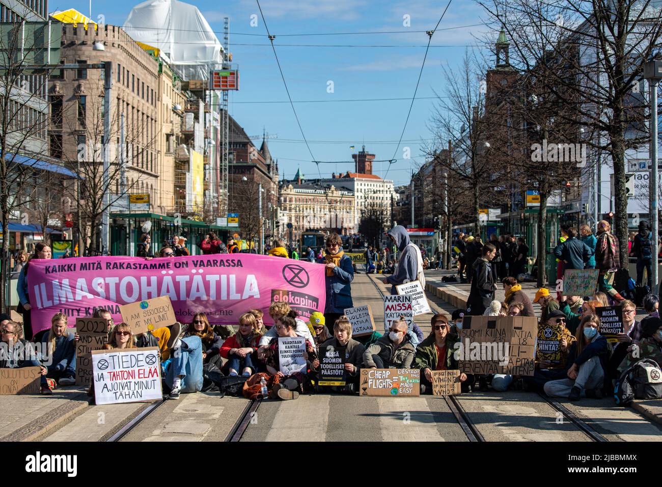 Ylikulutuskapina. Elokapina or Extinction Rebellion Finland protesters blocking Mannerheimintie tramway in Helsinki, Finland. Stock Photo
