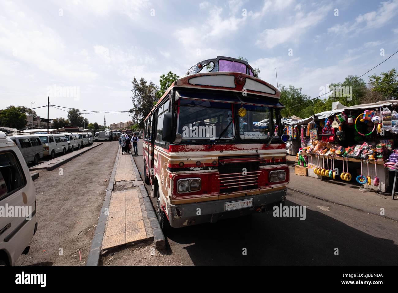 Damascus, Syria -May, 2022: Colorful old bus waiting at public bus station in Damascus Stock Photo