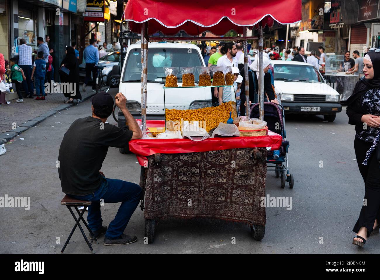 Damascus, Syria - May, 2022: Street seller selling corn snack Stock Photo
