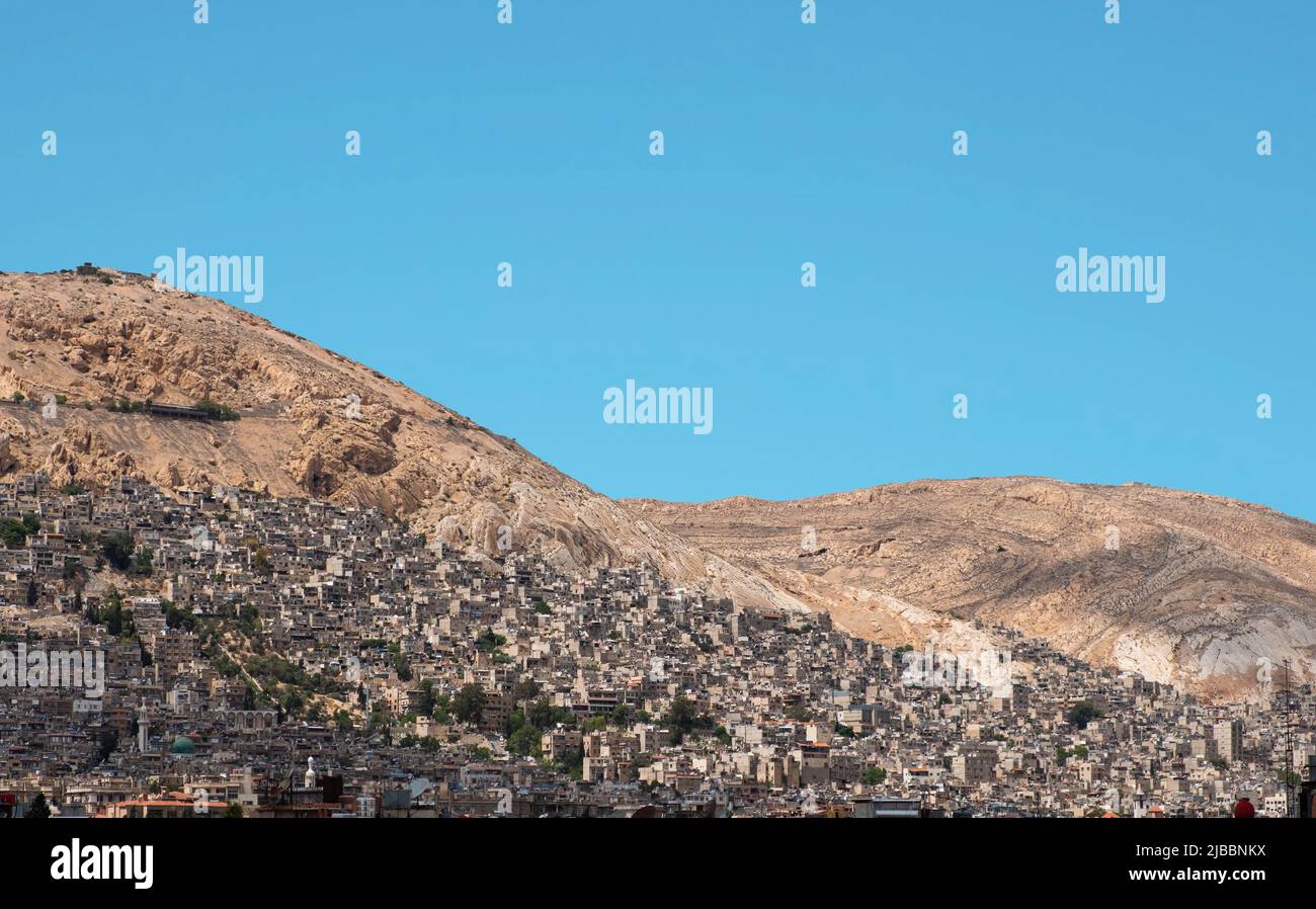 Skyline of Damascus City and Mountain (Mount Qasioun) Stock Photo