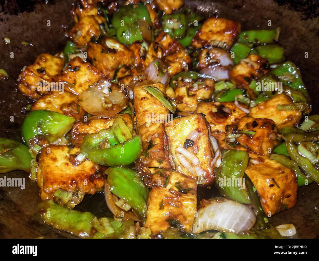 A closeup shot of homemade chilly paneer, hot spicy dry cheese recipe. India Stock Photo