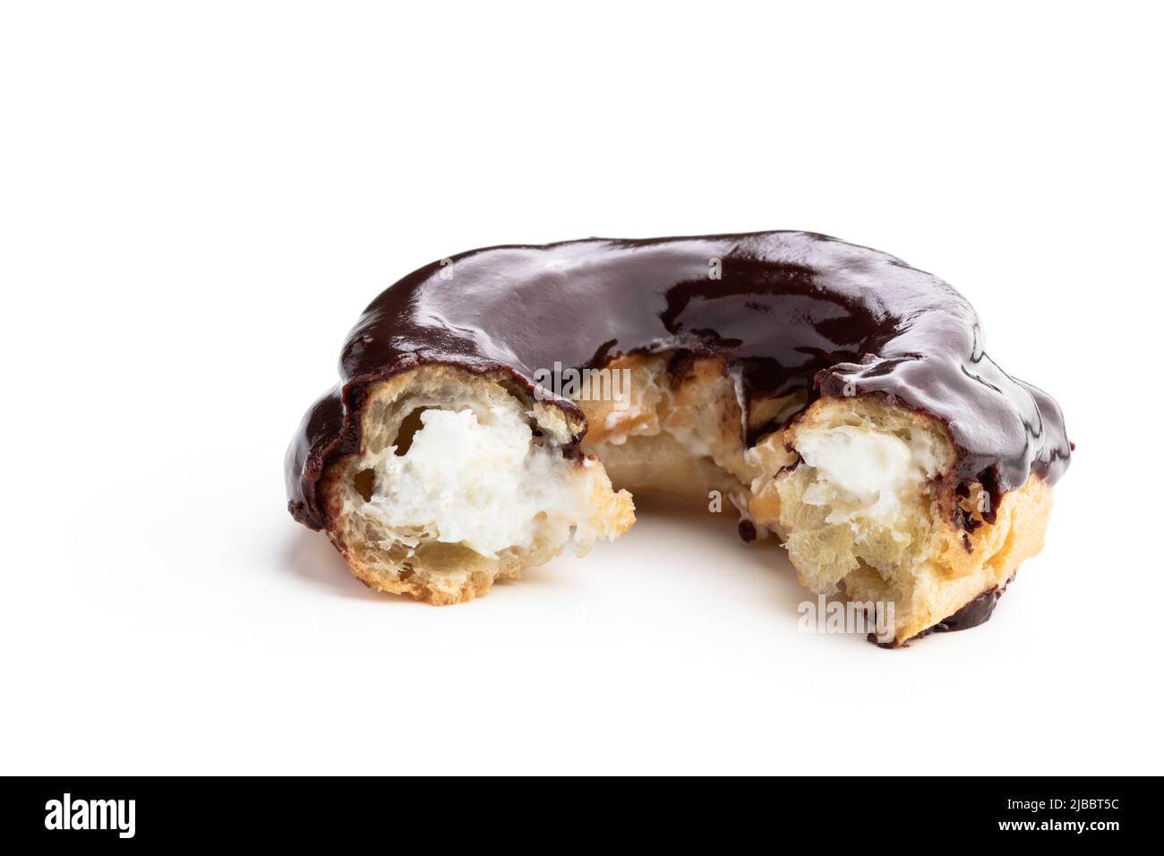 Ring-shaped  dark chocolate covered eclair isolated on white Stock Photo