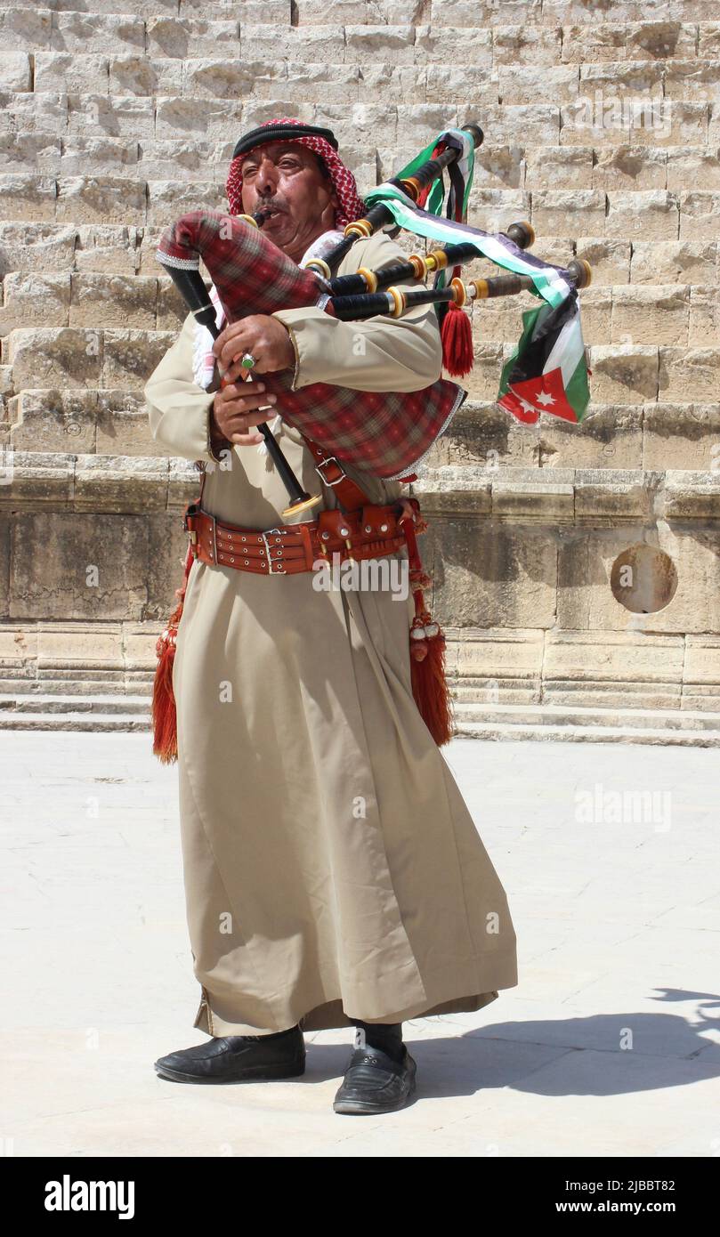 Jordanian Bagpiper at Jerash's Southern Theatre Stock Photo