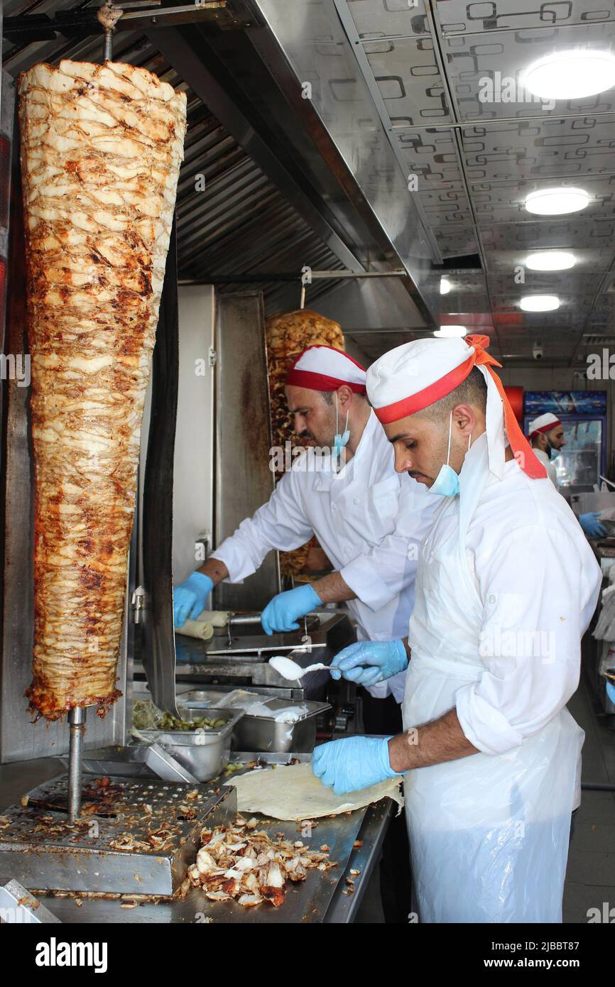 Doner kebab Shop, Amman Jordan - preparing chicken Shawarma wraps Stock Photo