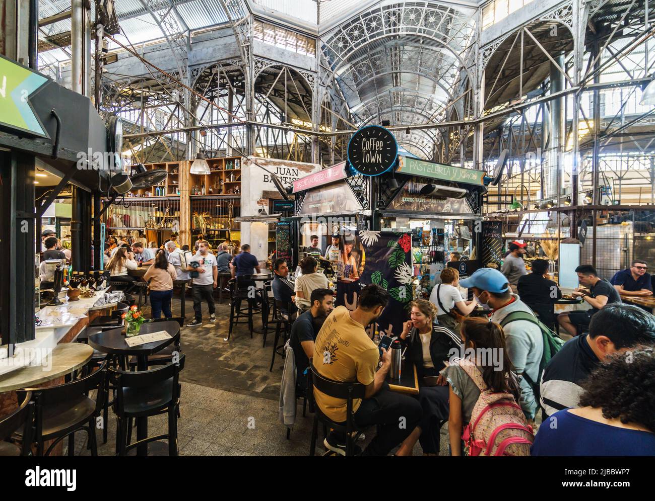 Buenos Aires, Argentina - March 20 2022: People eat in a restaurant in the famous San Telmo historic market food hall in Buenos Aires, Argentina capit Stock Photo