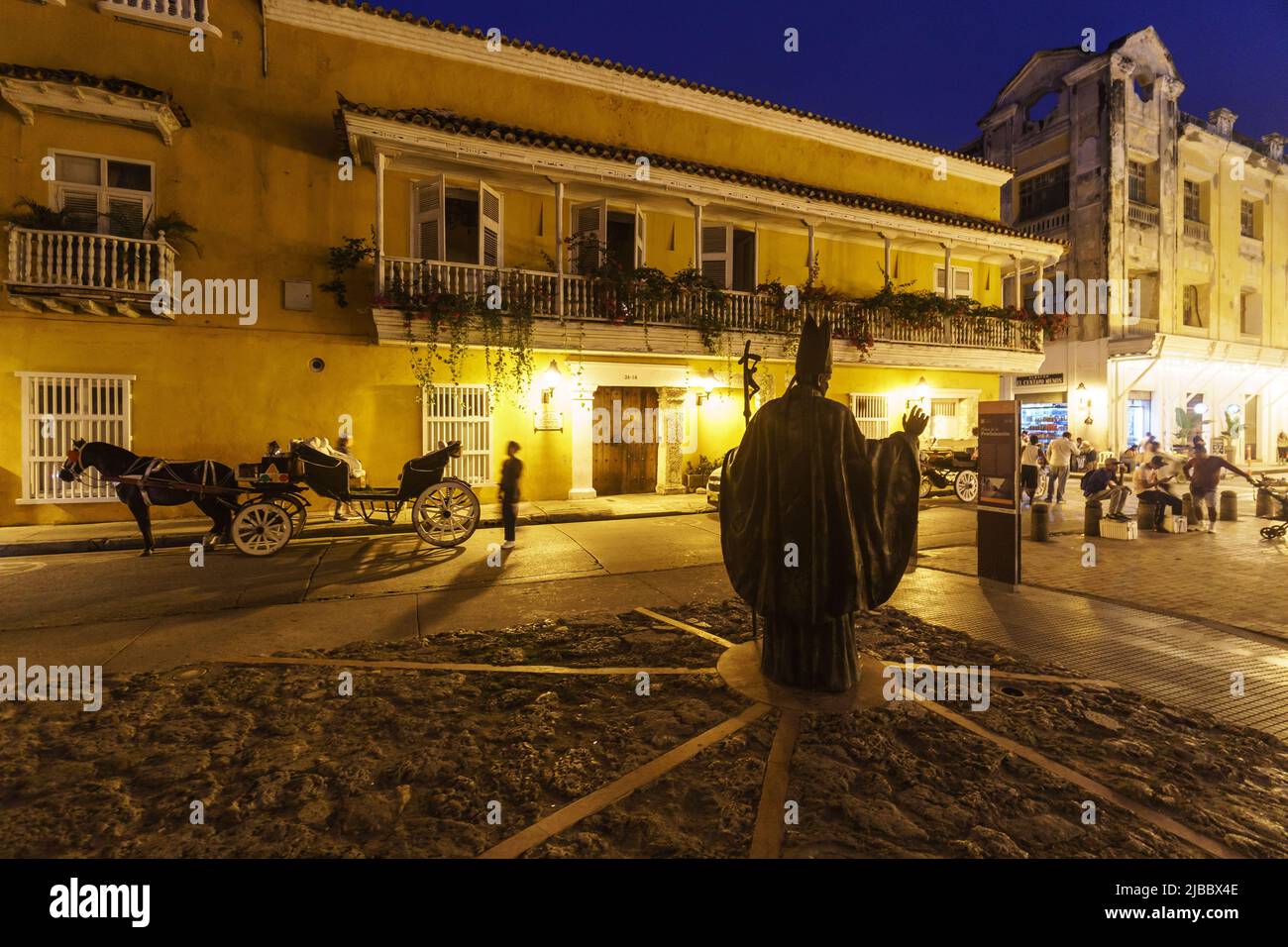 Cartagena, Colombia - May 11 2022: Night view of the Statue of Pope Francis commemorating his visit in 2017 that lies by the Plaza de la Proclamación Stock Photo