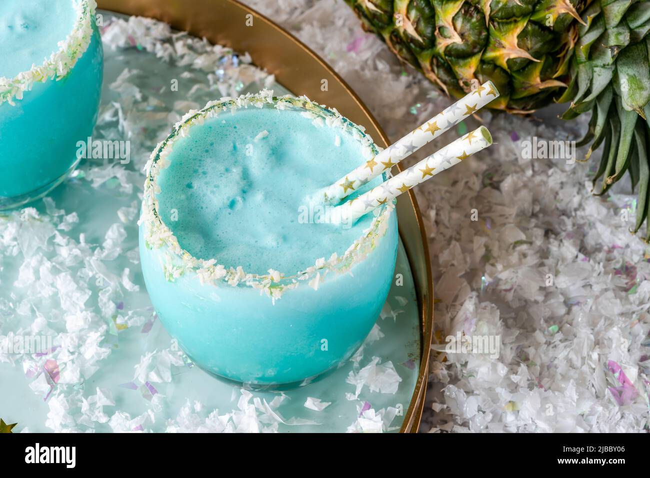 Jack Frost Christmas Cocktail with coconut rum, blue curacao, coconut