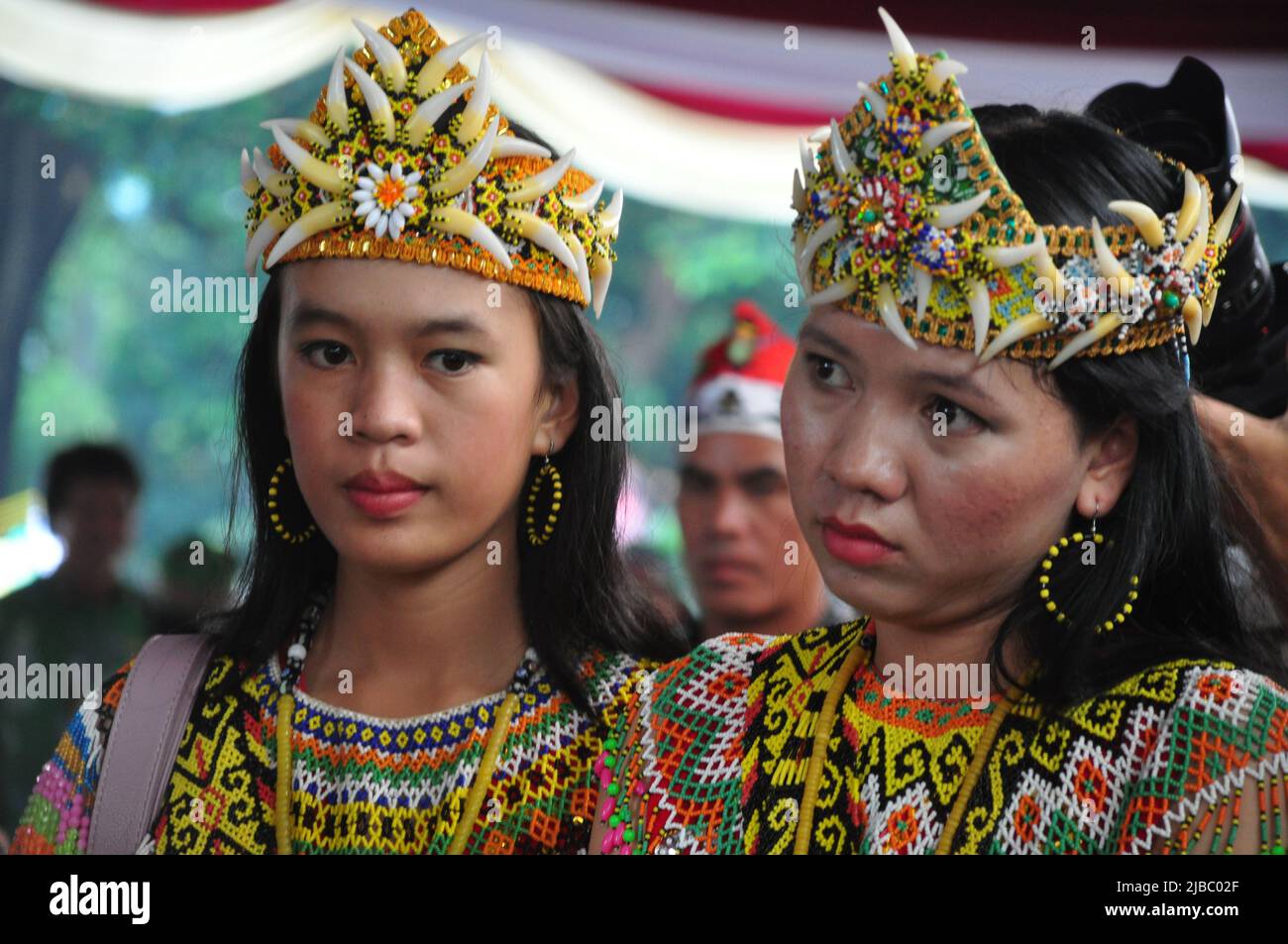 Jakarta, Indonesia - April 28, 2013 : Dayak women from Borneo, Kalimantan, wear traditional clothes at the Dayak festival in Jakarta, Indonesia Stock Photo
