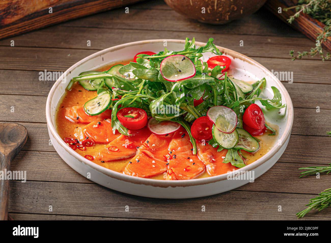 Plate of gourmet salmon carpaccio salad Stock Photo Alamy