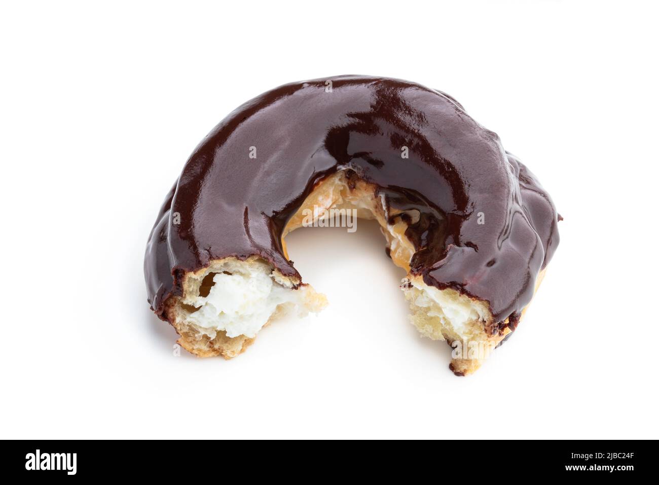 Ring-shaped  dark chocolate covered eclair isolated on white Stock Photo