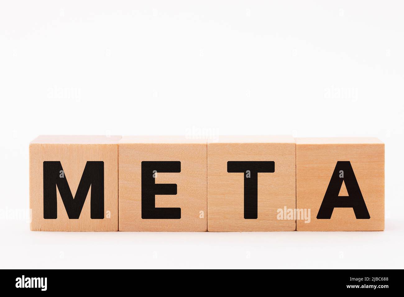 META, metafiction characters. The letters META drawn on a wooden block. Black text Stock Photo