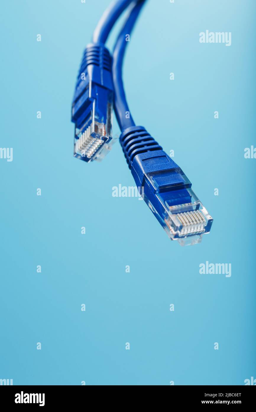Blue Ethernet Cable Connectors Patch cord cord close-up isolated on a ...