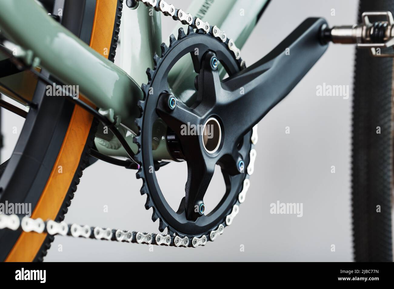 The leading star of a bicycle with a connecting rod and a chain close