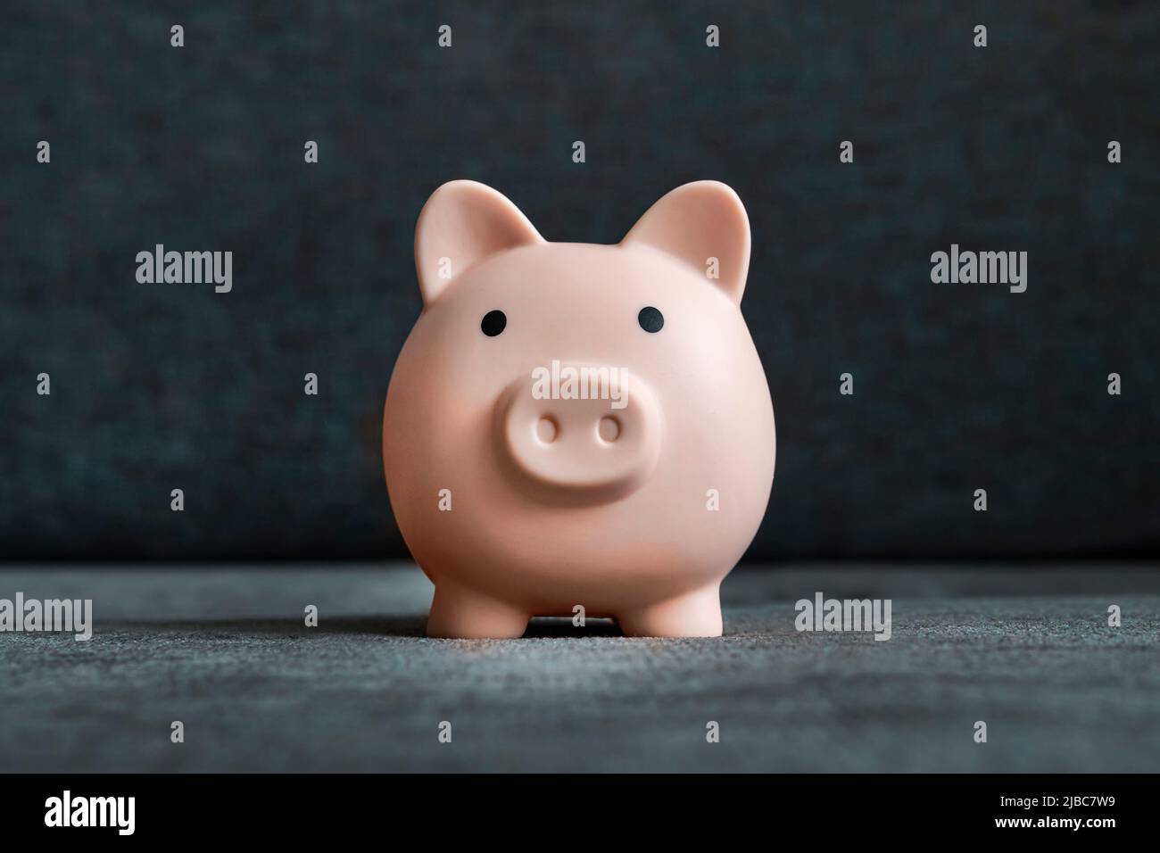 Blue piggy bank money box black studio background Stock Photo - Alamy