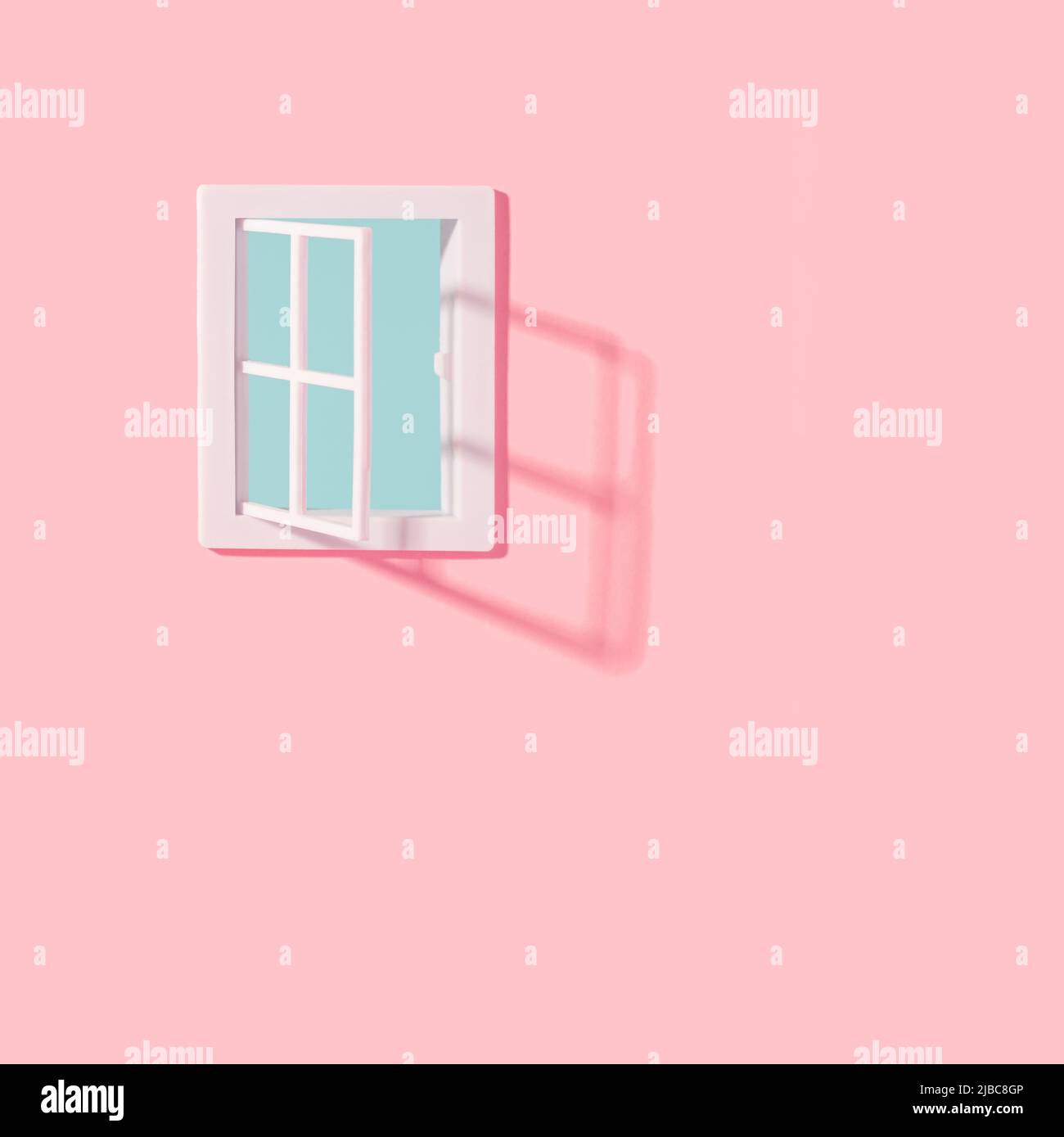 Open plastic window on a pastel pink wall with clear blue sky seeing through. Opportunity, hope minimal concept. Stock Photo