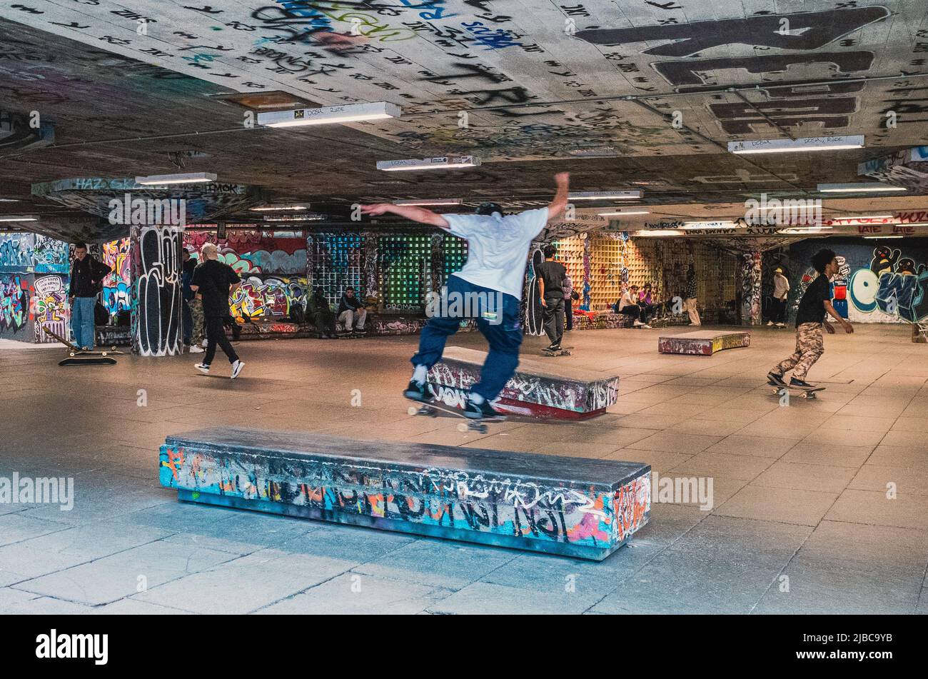 Skateboarders practice at the famous Southbank Skatepark, under the Southbank Centre in London Stock Photo
