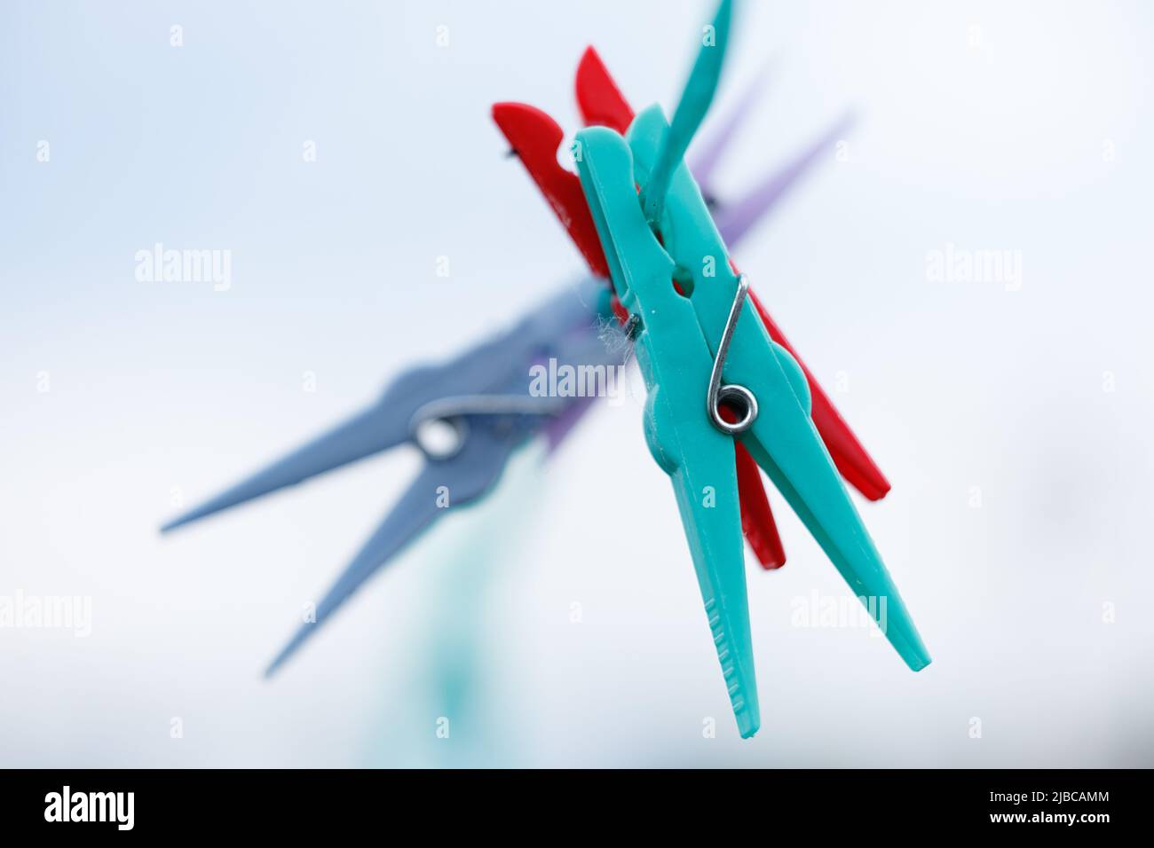 colored clothespins on a line Stock Photo