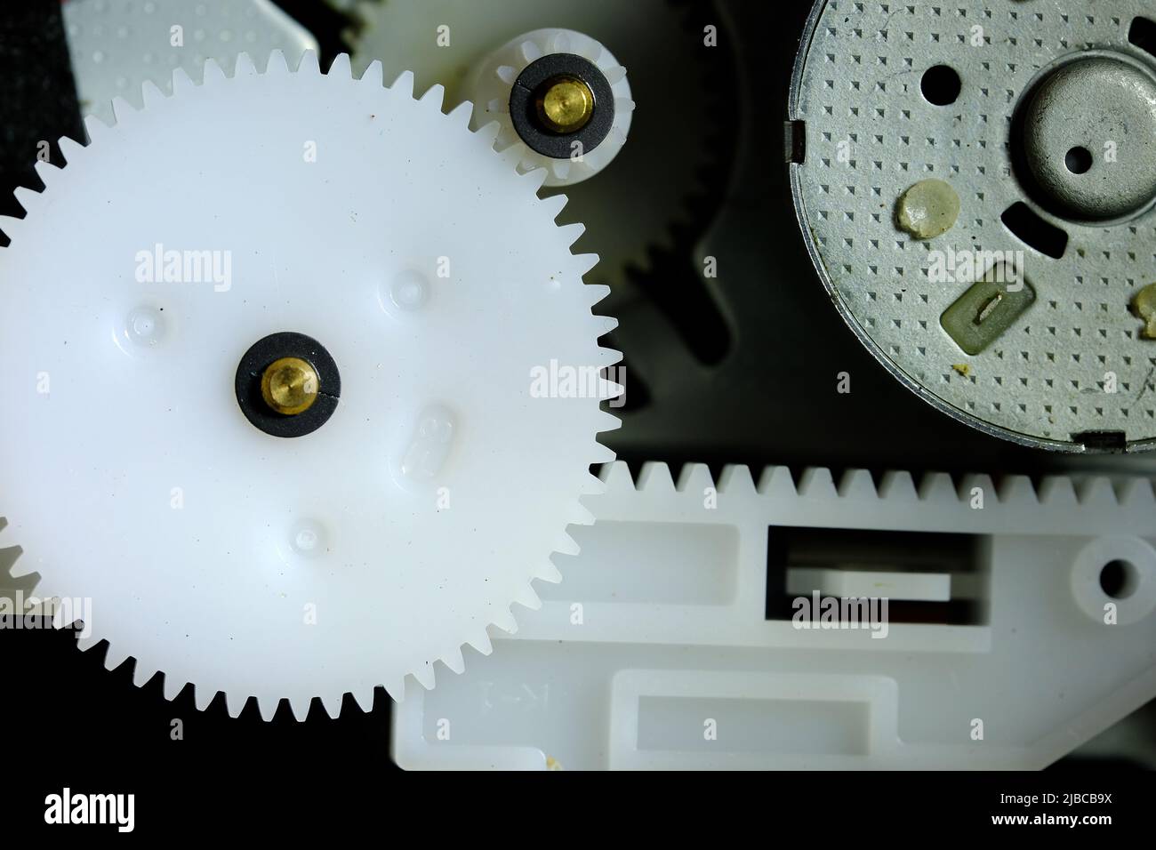 Plastic cogs and gears in a DVD drive Stock Photo Alamy