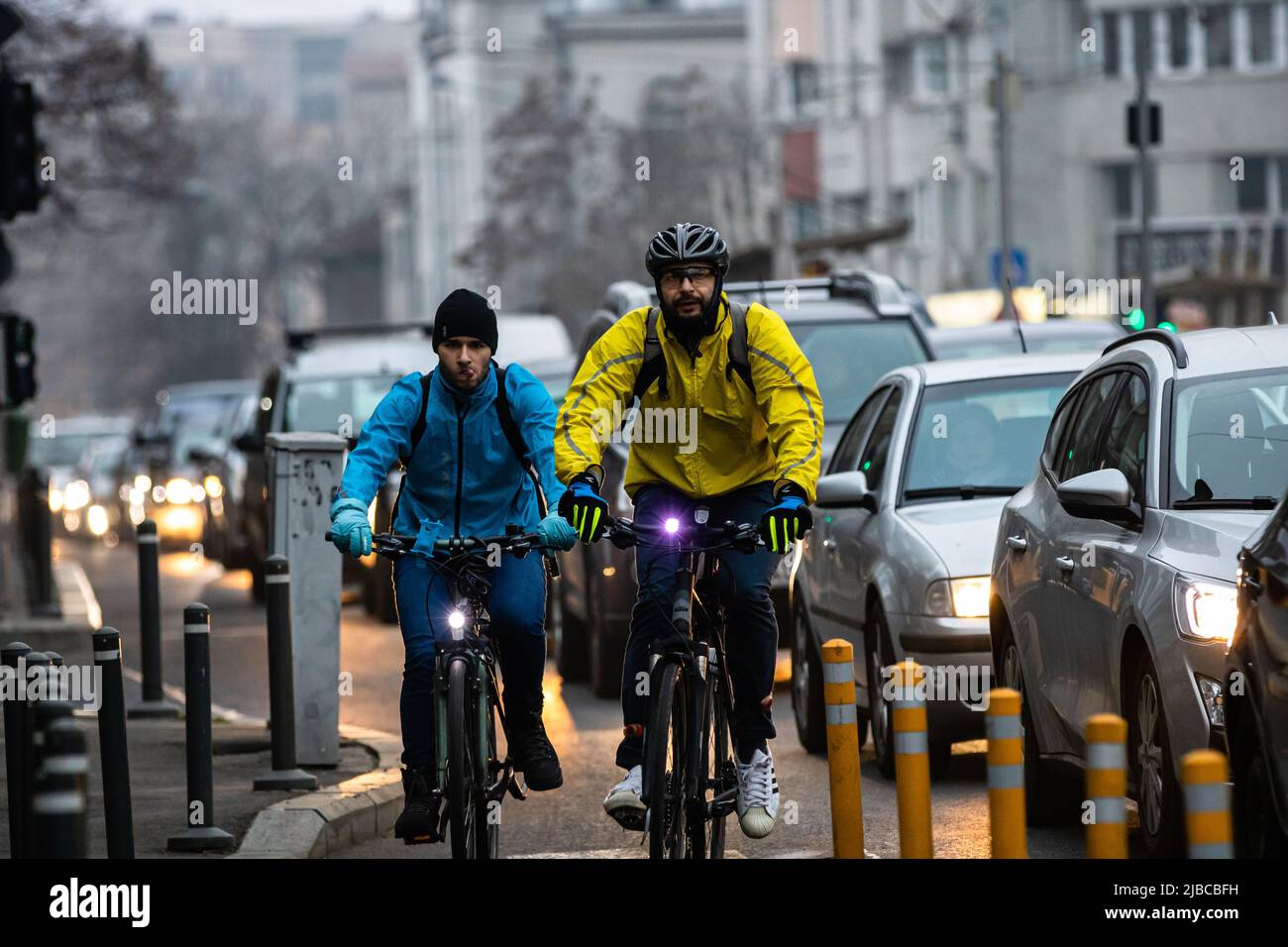 Riding a bicycle on the city streets. Commute to work in Bucharest