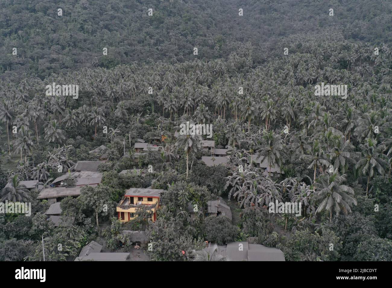 Bulusan, Philippines. 5th June 2022. (220605) -- SORSOGON PROVINCE, June 5, 2022 (Xinhua) -- Aerial photo shows an ash-covered town after the phreatic eruption of Bulusan volcano in Sorsogon Province, the Philippines on June 5, 2022. The Philippine Institute of Volcanology and Seismology on Sunday raised the alert level for Bulusan volcano from zero to one after the volcano in Sorsogon province, southeast of Manila, spewed a grey plume about a kilometer high into the sky. (Sorsogon Provincial Information Office/Handout via Xinhua) Credit: Xinhua/Alamy Live News Stock Photo