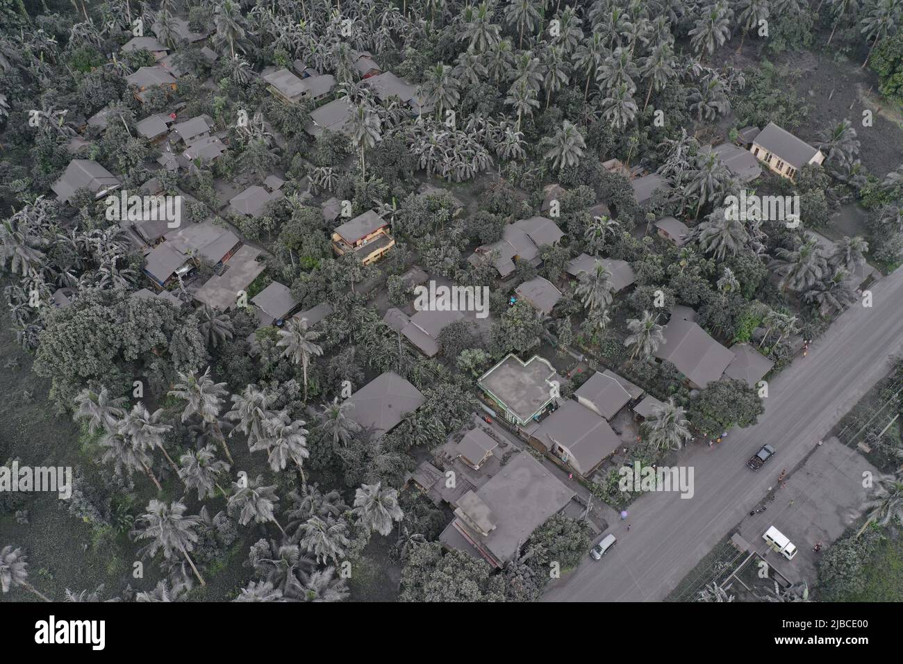 Bulusan, Philippines. 5th June 2022.   Aerial photo shows an ash-covered town after the phreatic eruption of Bulusan volcano in Sorsogon Province, the Philippines on June 5, 2022. The Philippine Institute of Volcanology and Seismology on Sunday raised the alert level for Bulusan volcano from zero to one after the volcano in Sorsogon province, southeast of Manila, spewed a grey plume about a kilometer high into the sky. (Sorsogon Provincial Information Office/Handout via Xinhua) Credit: Xinhua/Alamy Live News Stock Photo