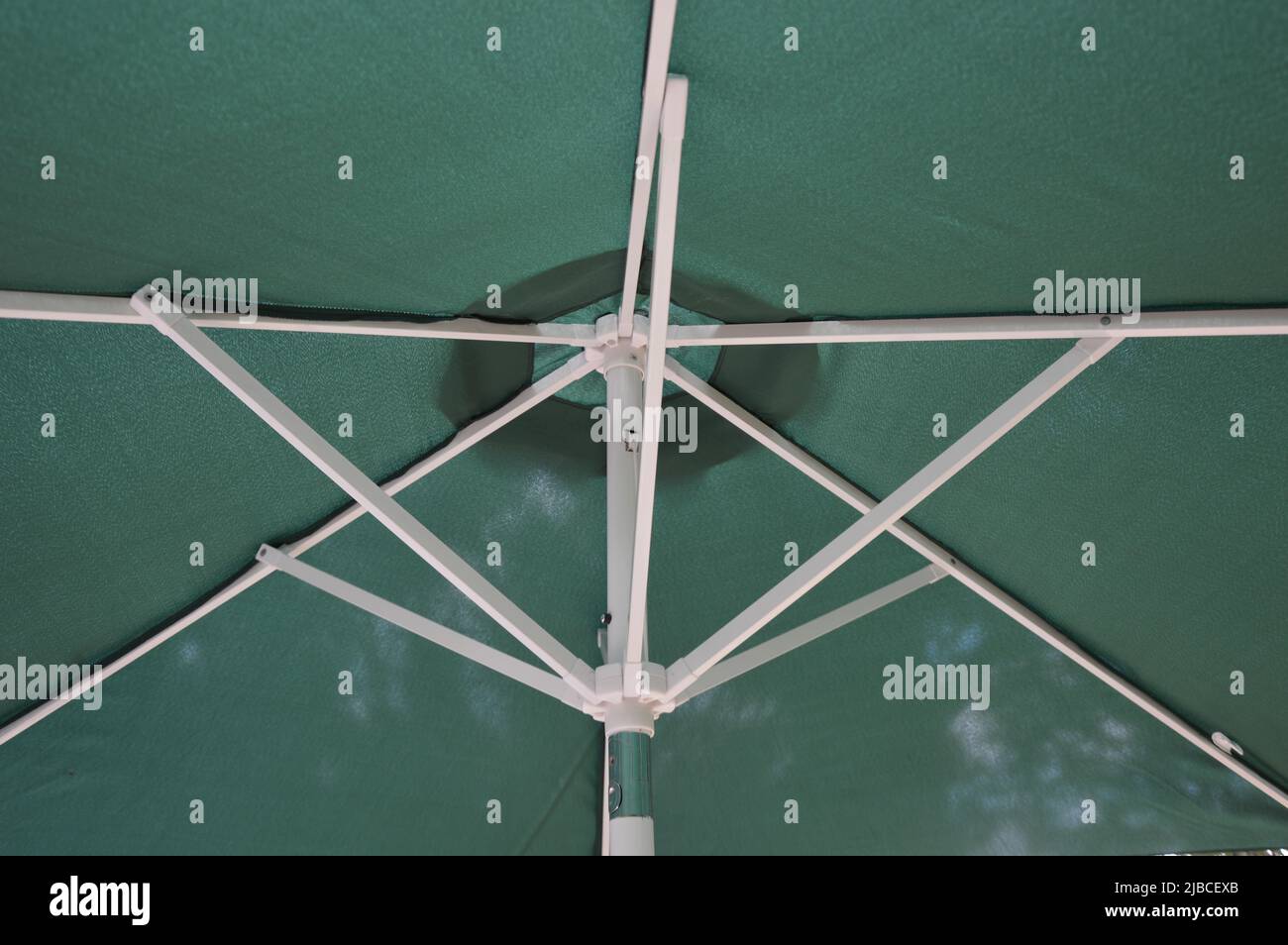 Outdoor umbrella stretcher, tube and runner outdoor Stock Photo Alamy