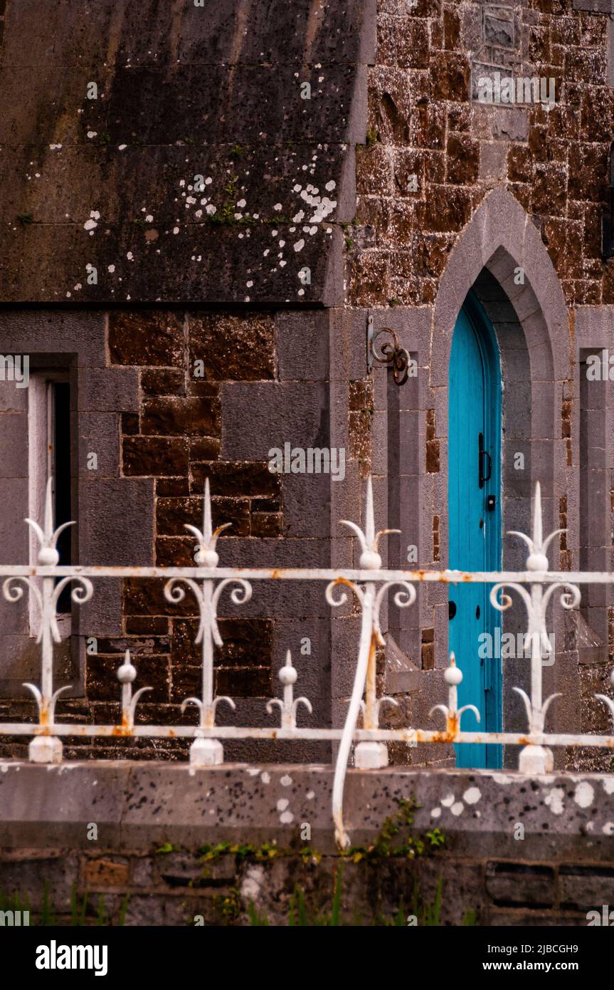 Cut stone arts and crafts style home with a Gothic style arched