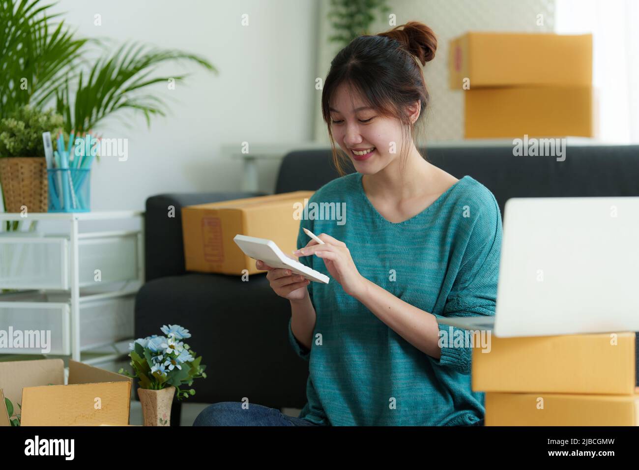 Asian small business owner working at home office. Business retail